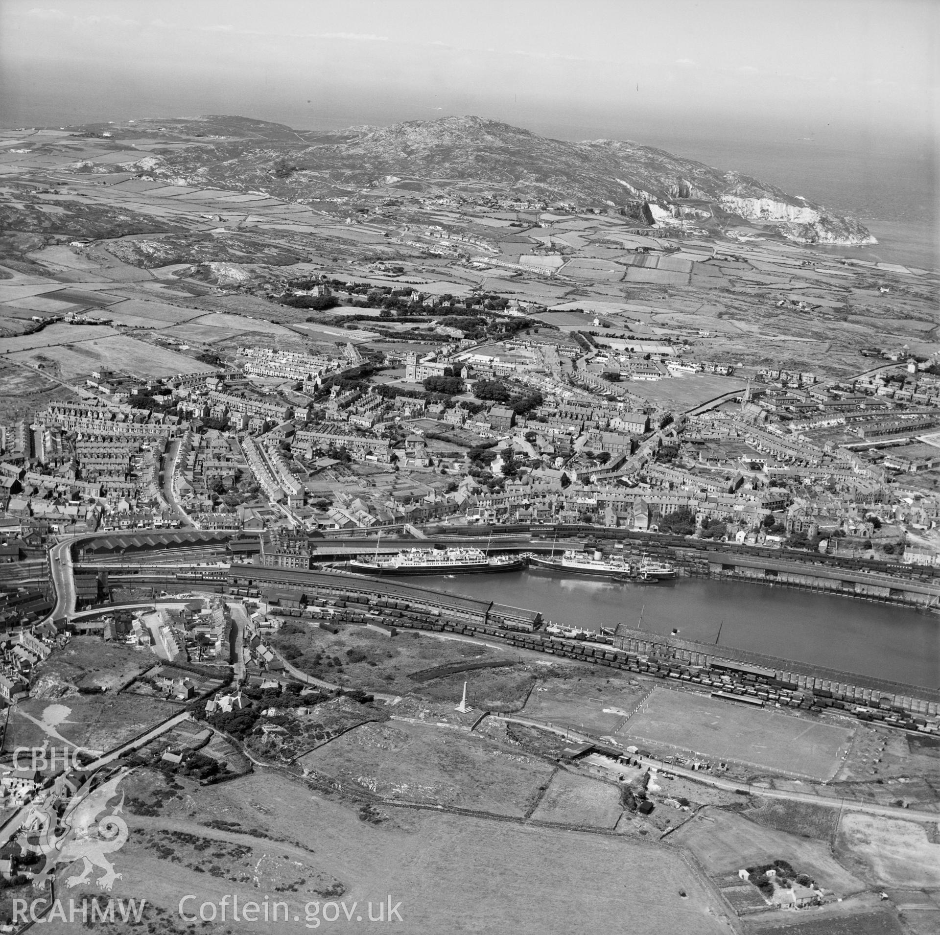 View of Holyhead showing port, with football ground in the foreground.