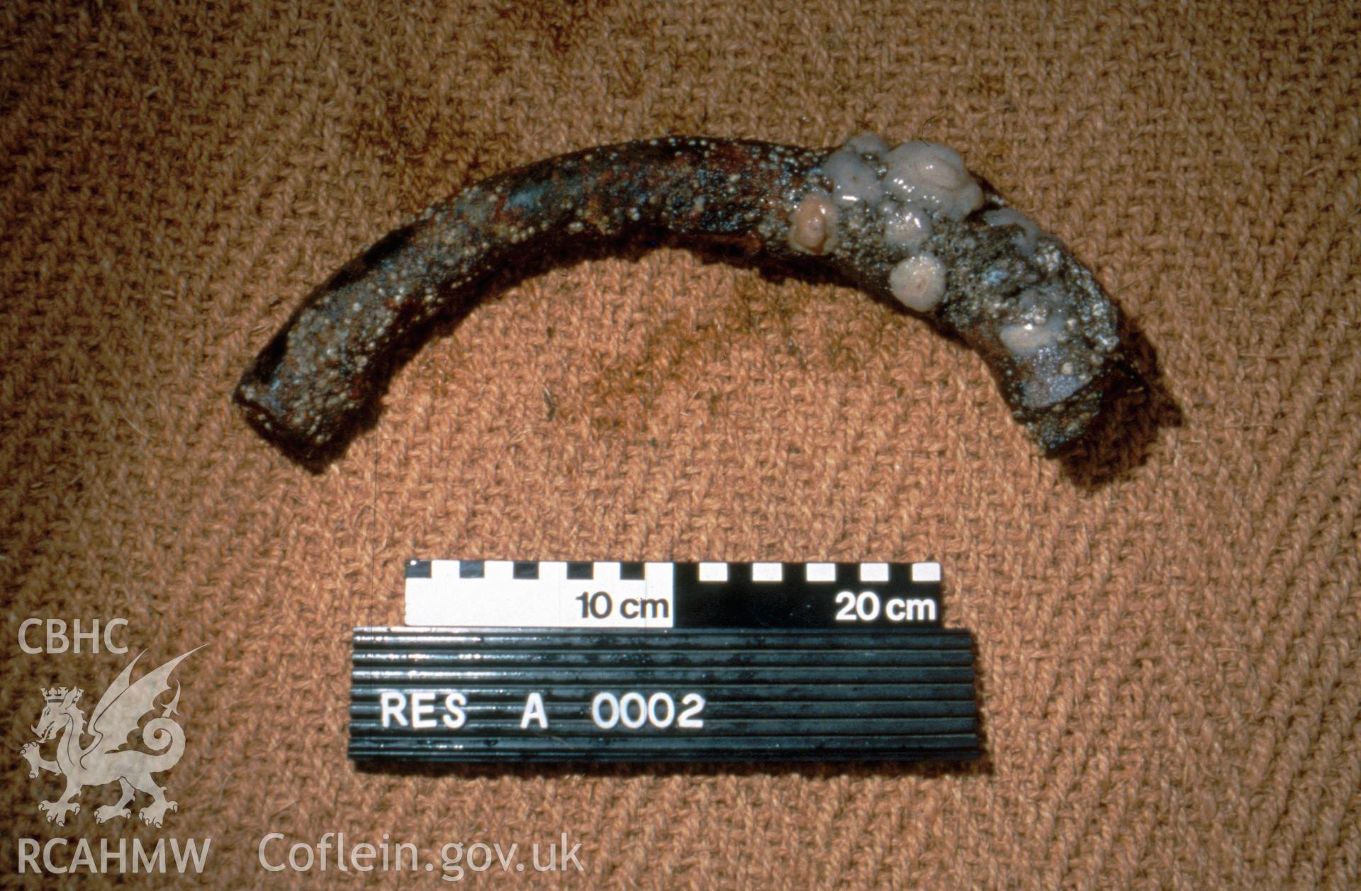 Colour slide. Artefact (with photoscale) RES A 0002 - section of steering wheel.