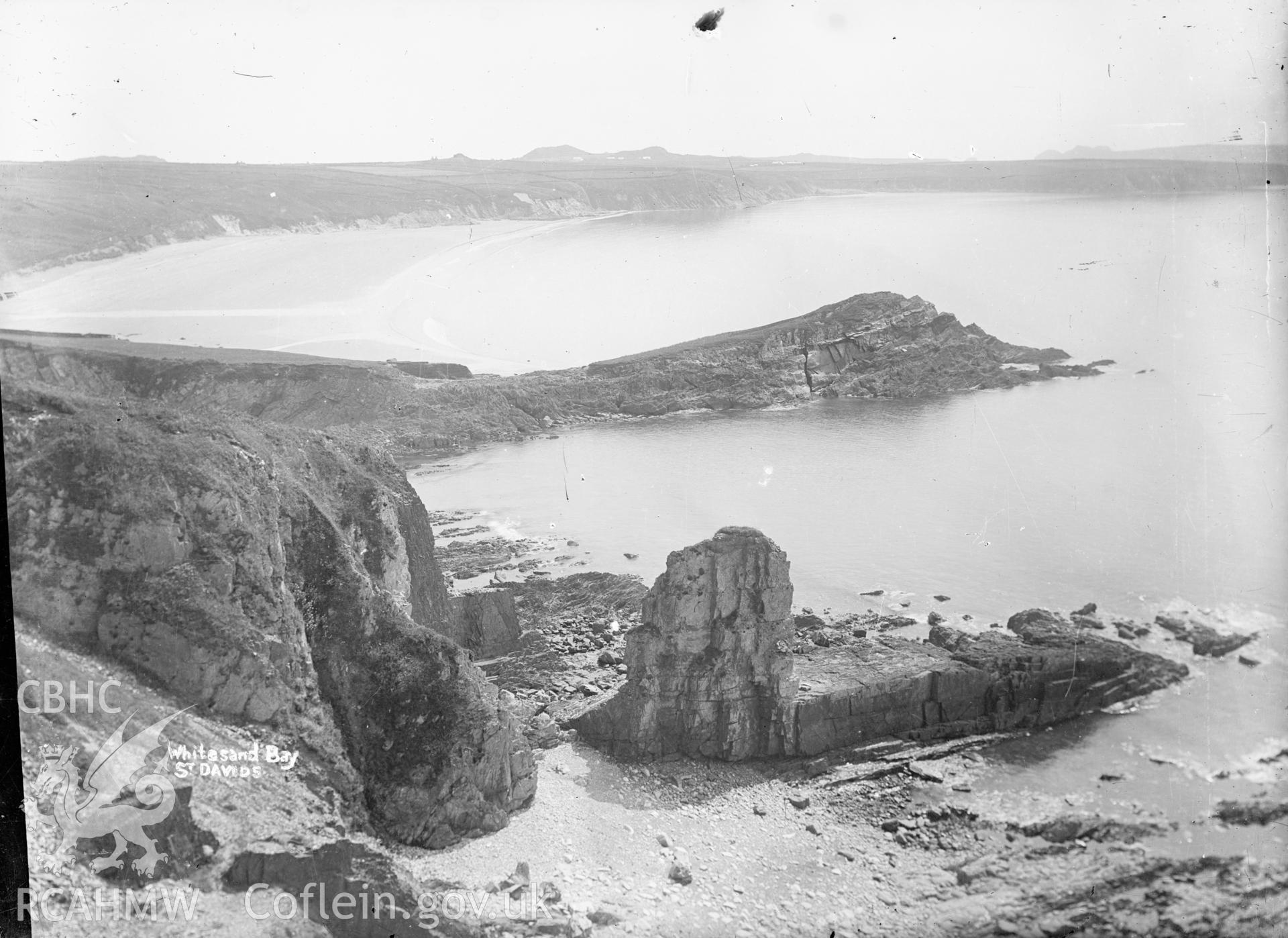 Black and white glass negative showing Whitesand Bay, St Davids.