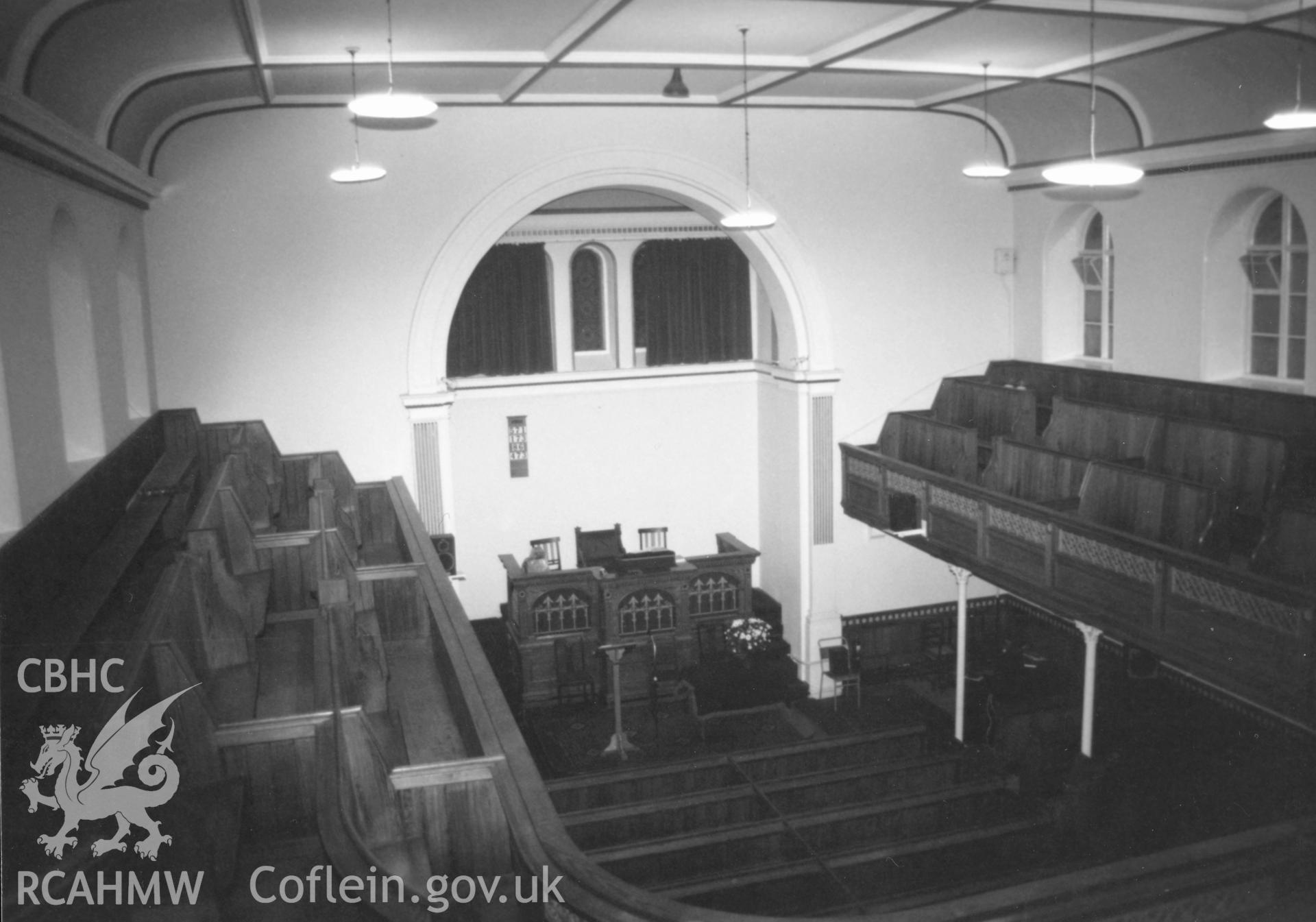 Digital copy of a black and white photograph showing an interior view of Hill Park Baptist Chapel, Haverfordwest, taken by Robert Scourfield, 1996.