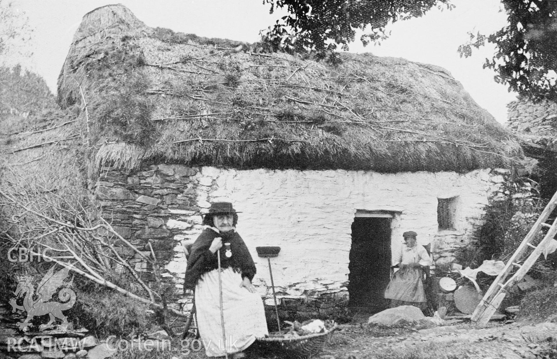 Copy of black and white image of Castell Cottage, Ystrad Fflur, copied from early photgraph showing thatched cottage and figure, loaned by David Williams.