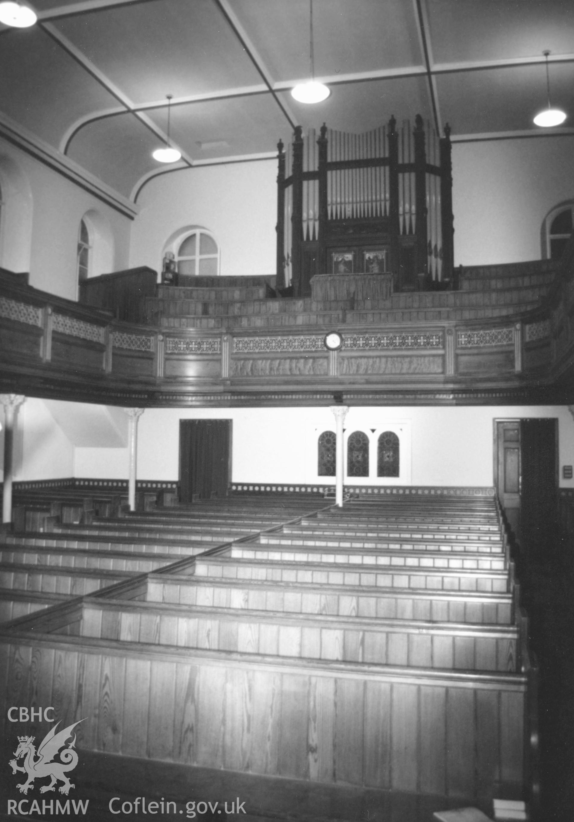 Digital copy of a black and white photograph showing an interior view of Hill Park Baptist Chapel, Haverfordwest, taken by Robert Scourfield, 1996.