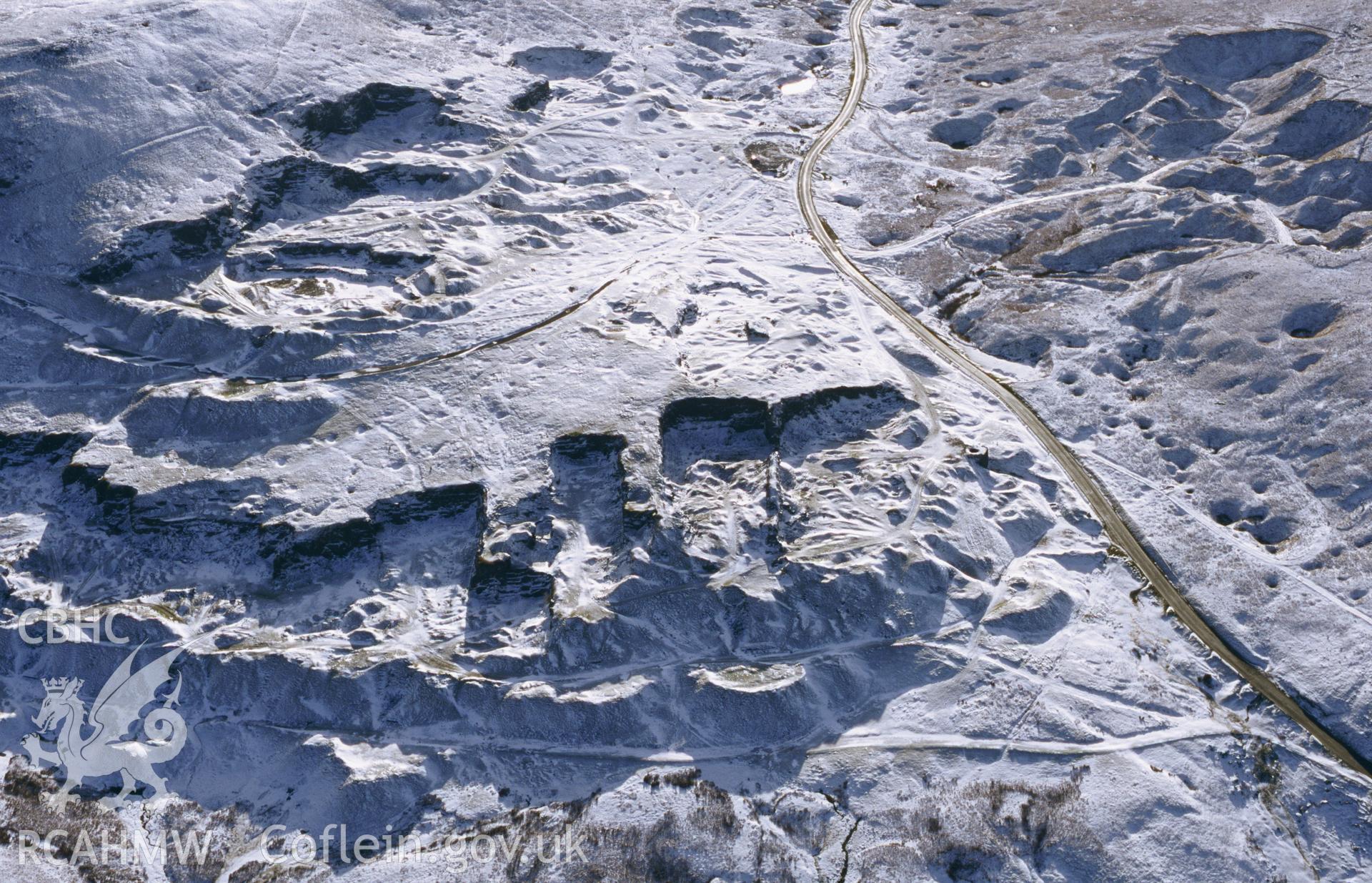 RCAHMW colour oblique aerial photograph of Foel Fawr, quarry complex, under snow, from N. Taken by Toby Driver on 10/01/2003