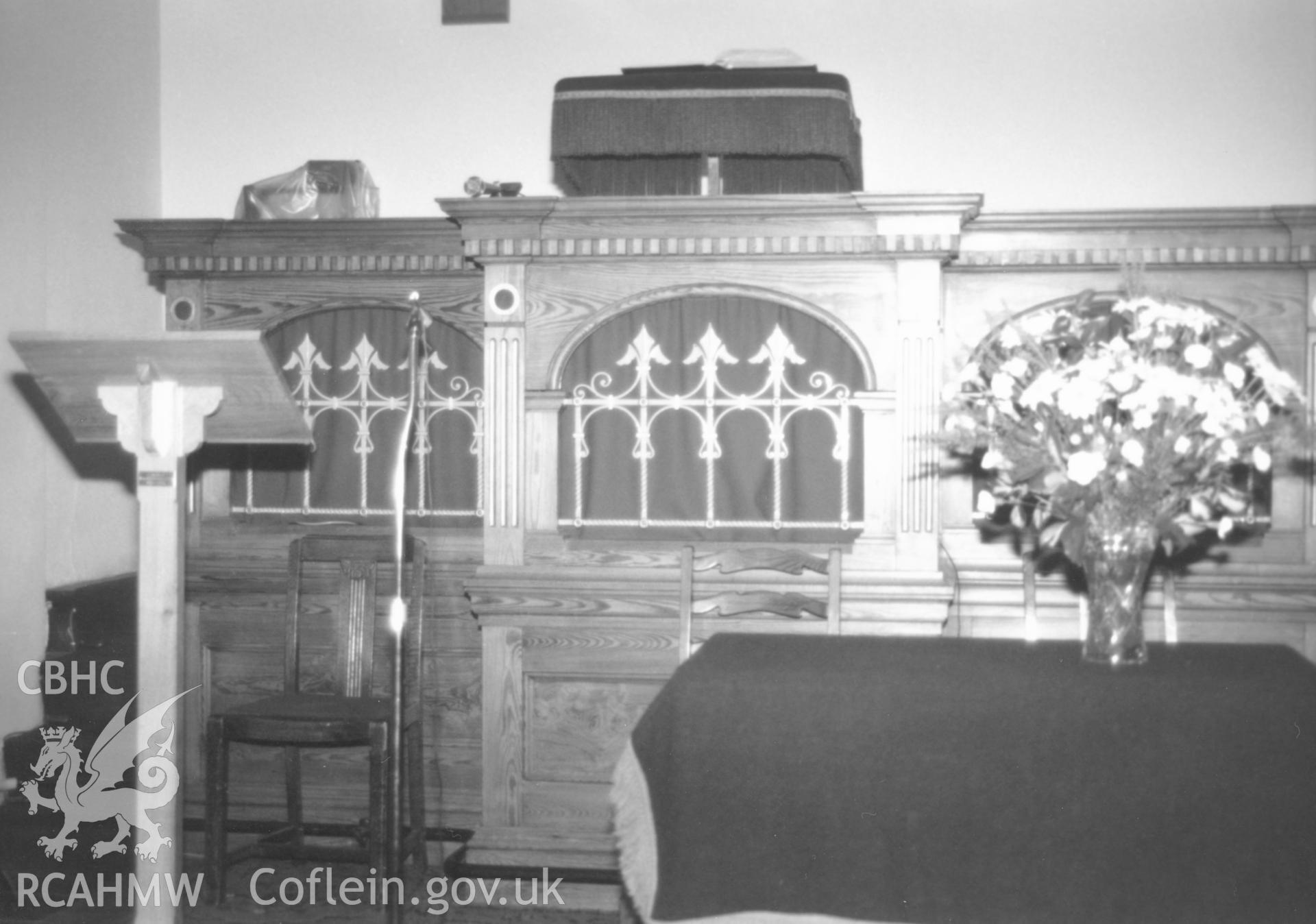 Digital copy of a black and white photograph showing an interior view of Hill Park Baptist Chapel, Haverfordwest, taken by Robert Scourfield, 1996.