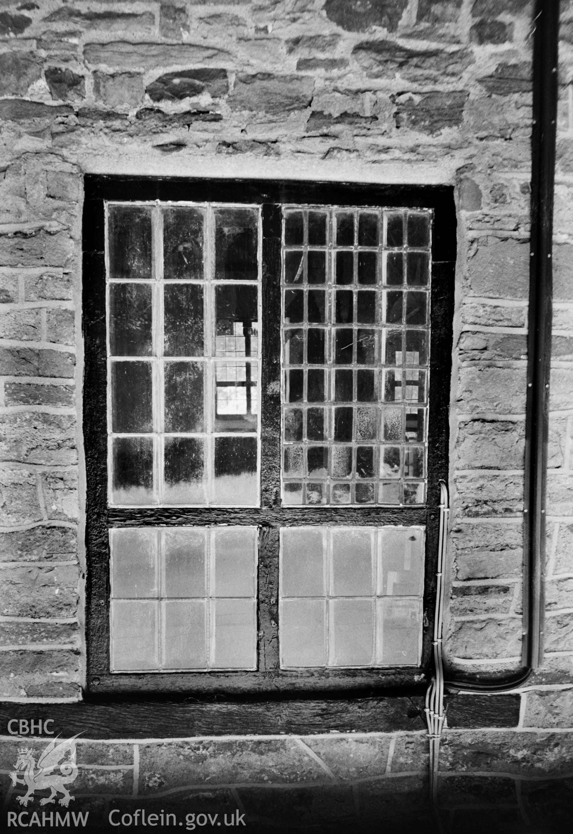 Exterior, original mullioned & transomed window with partial early glazing. NA/RA/94/017
