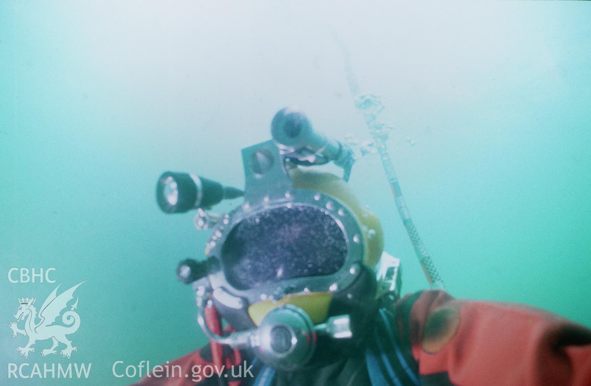View showing diver from the Archaeological Diving Unit ascending to the surface after completing the dive, one of a set of 41 colour slides from an underwater survey of the Tal-y-Bont designated shipwreck, carried out by the Archaeological Diving Unit.