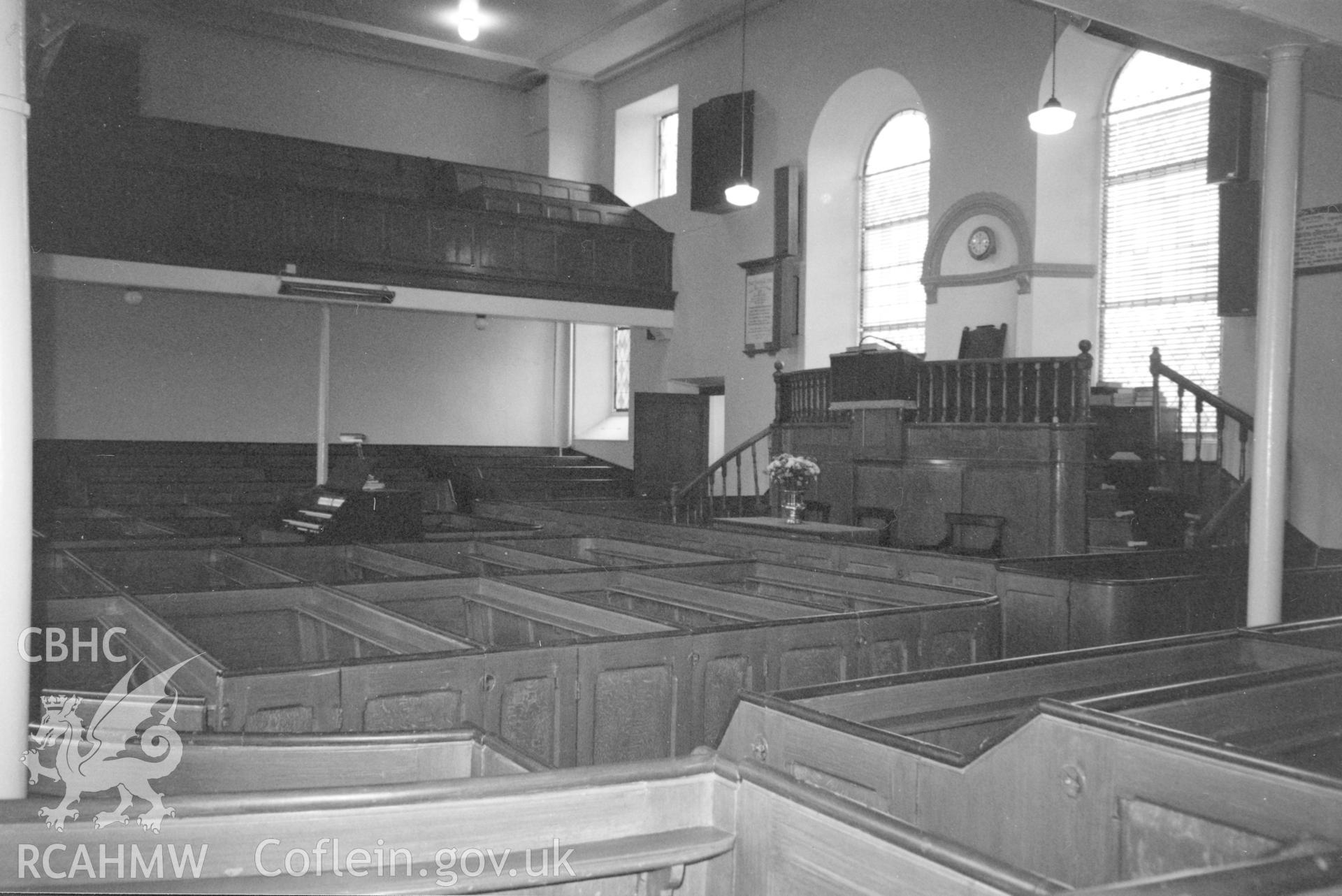 Digital copy of a black and white photograph showing an interior view of Capel y Graig Independent Chapel, Rhydwenog, taken by Robert Scourfield, c.1996.