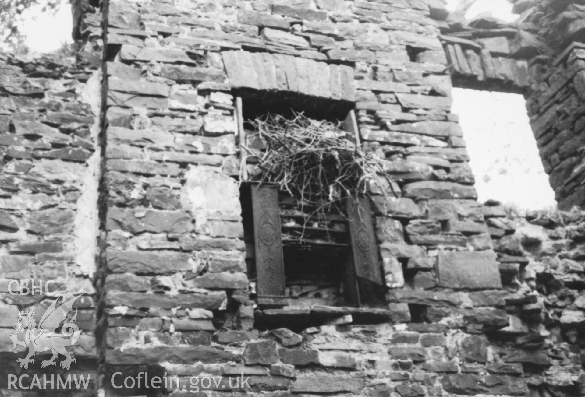 Copy of b/w photo of fireplace in situ in the new wing, Llwynwormwood. Copied from original loaned by Thomas Lloyd Copy negative held.