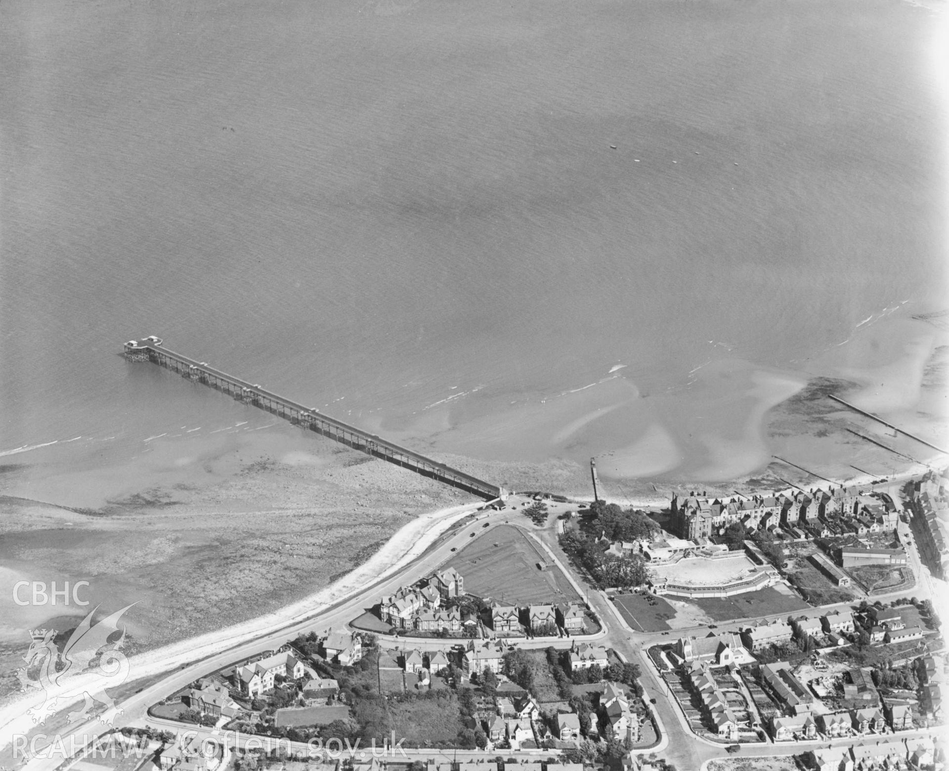 Black and white oblique aerial photograph showing Rhos-on-sea Pier, from Aerofilms album no. (Denbs A-K), taken by Aerofilms Ltd and dated 1934.