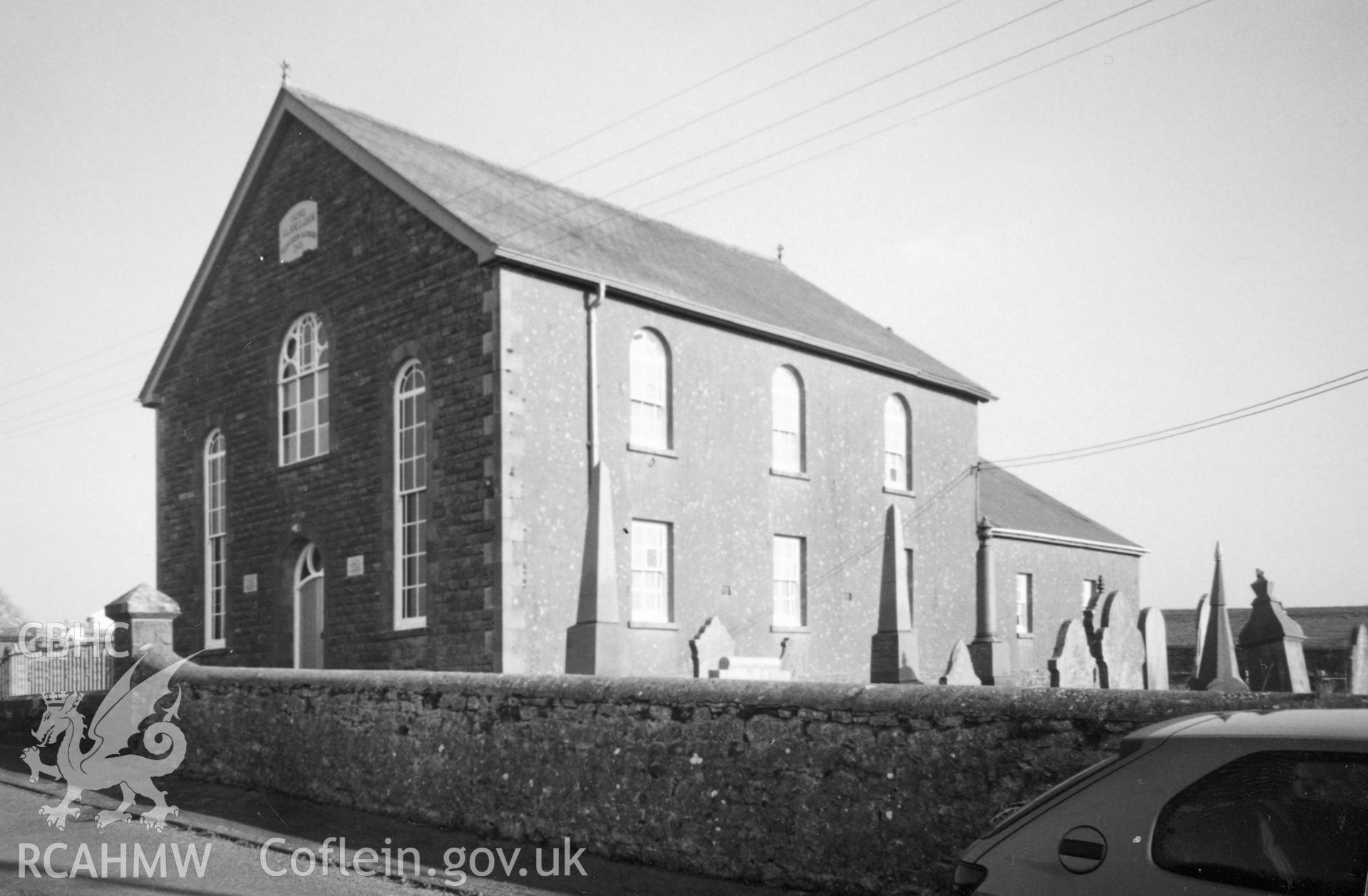 Digital copy of a black and white photograph showing an exterior view of Llan-lluan Calvinistic Methodist Chapel, Maes y Bont taken by Robert Scourfield, c.1996.