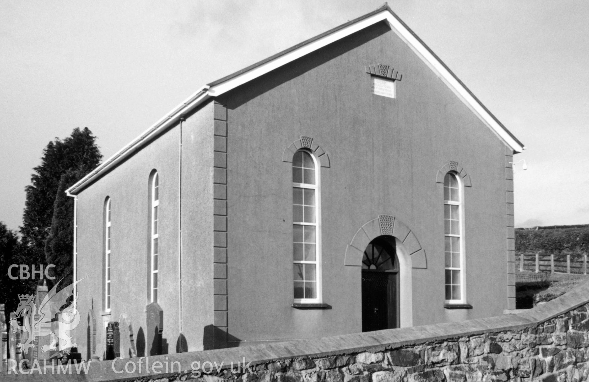 Digital copy of a black and white photograph showing an exterior view of Capel Gwyn Chapel, Abergwili, taken by Robert Scourfield, 1996.