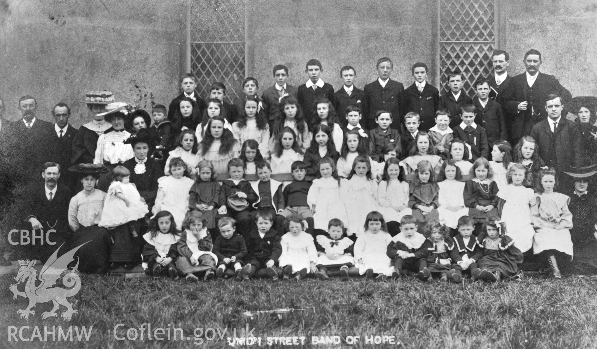 Copy of b/w postcard of a group photograph of the Union Street Band of Hope temperance movement, Carmarthen. Copied from original loaned by Thomas Lloyd.  Copy negative held.