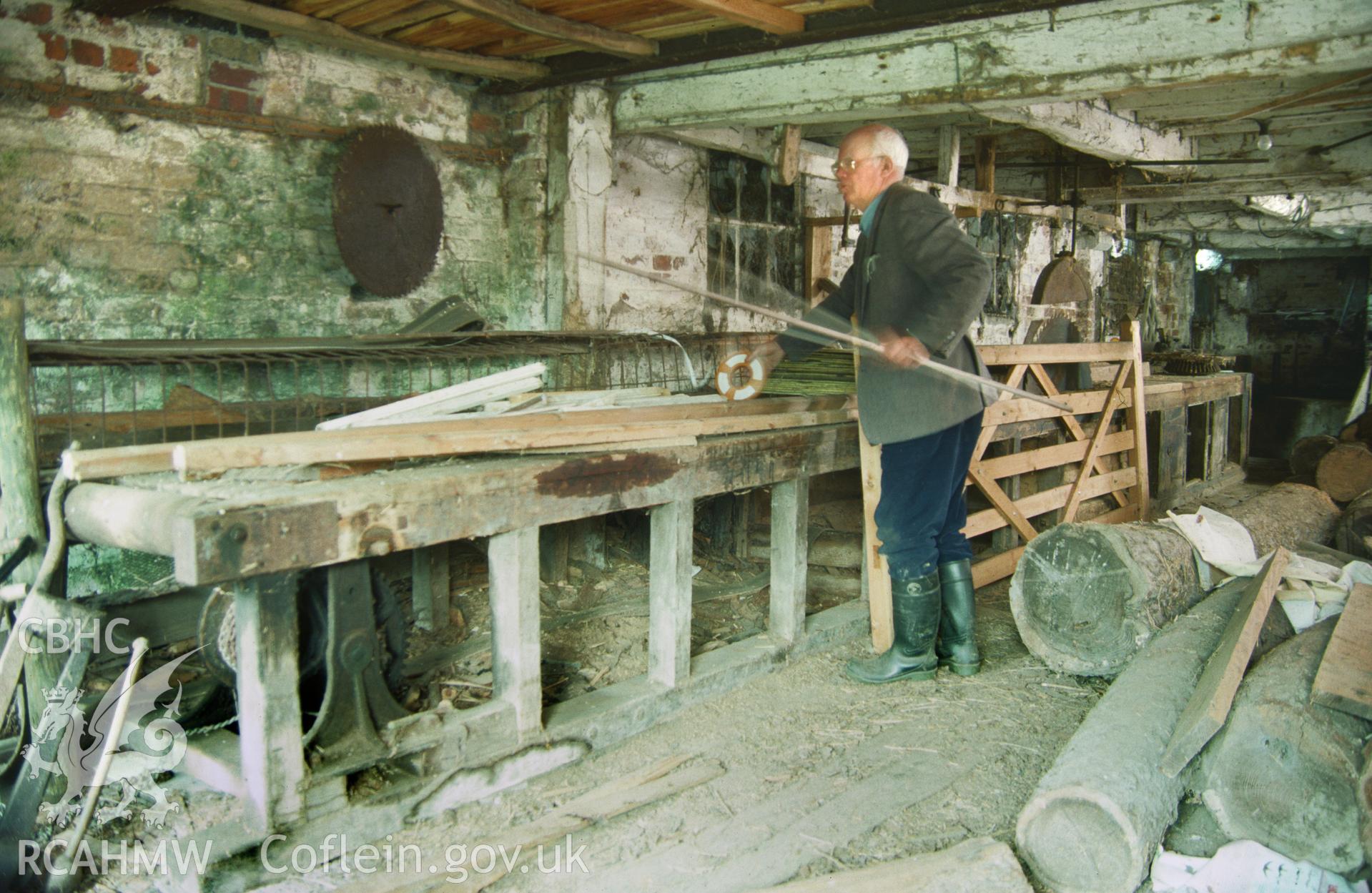 Digitized image of a colour slide of the interior of Whitebridge Farm Sawmill, taken by and loaned for copying by Stephen Hughes.