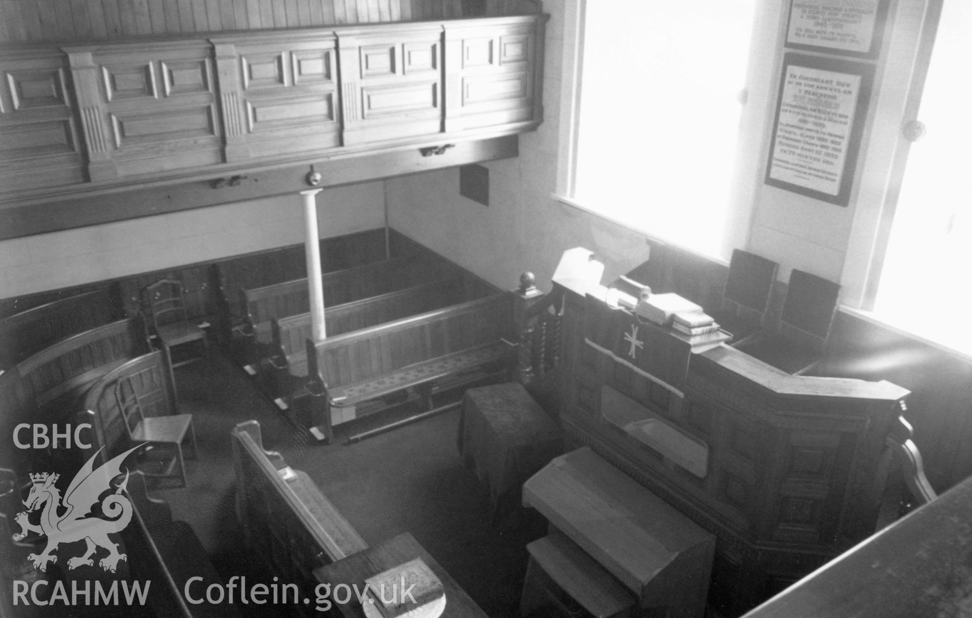 Digital copy of a black and white photograph showing an interior view of Phildelffia Welsh Independent Chapel, Nantycaws, taken by Robert Scourfield, c.1996.