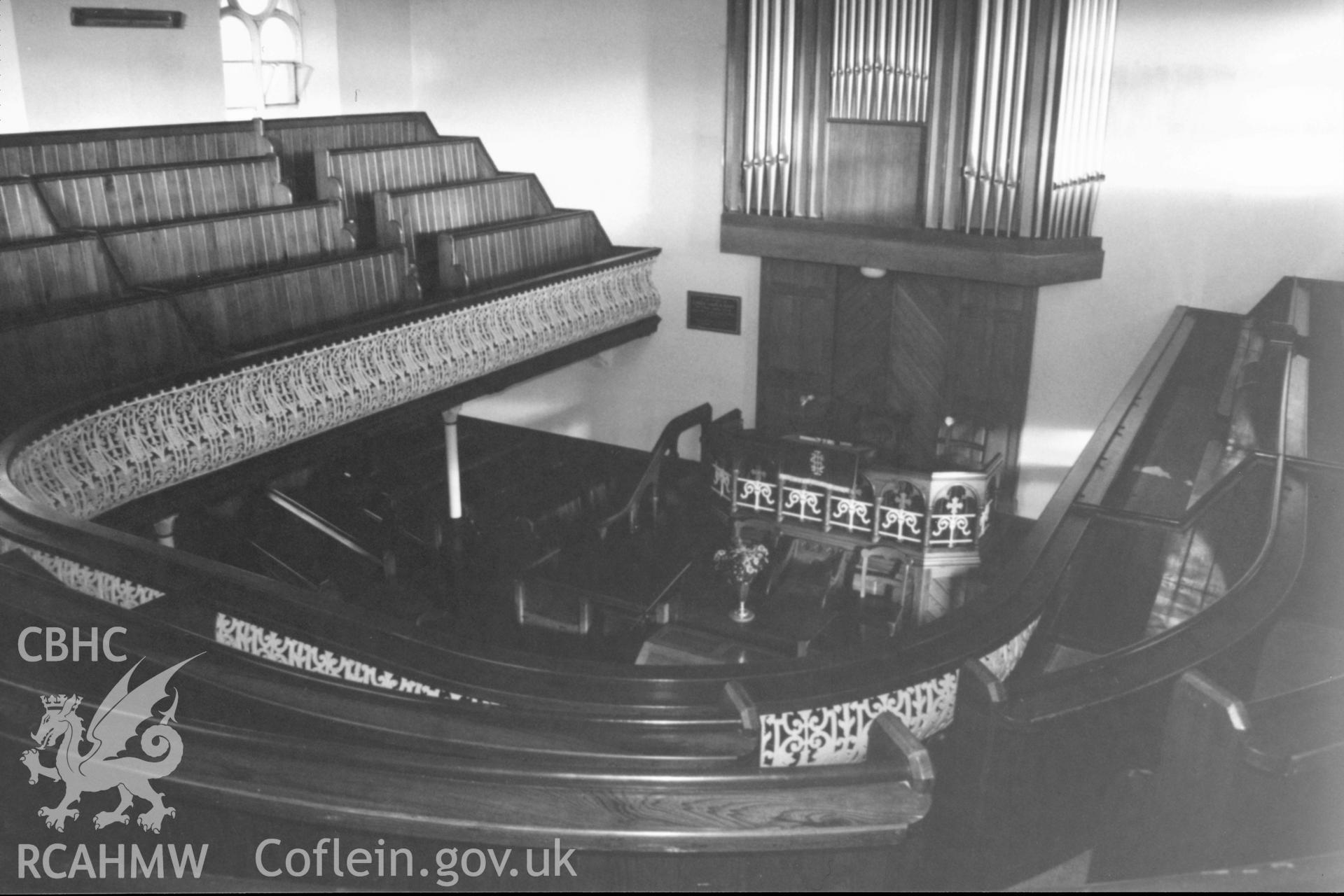 Digital copy of a black and white photograph showing an interior view of Peniel Independent Chapel, Abergwili, taken by Robert Scourfield, 1996.