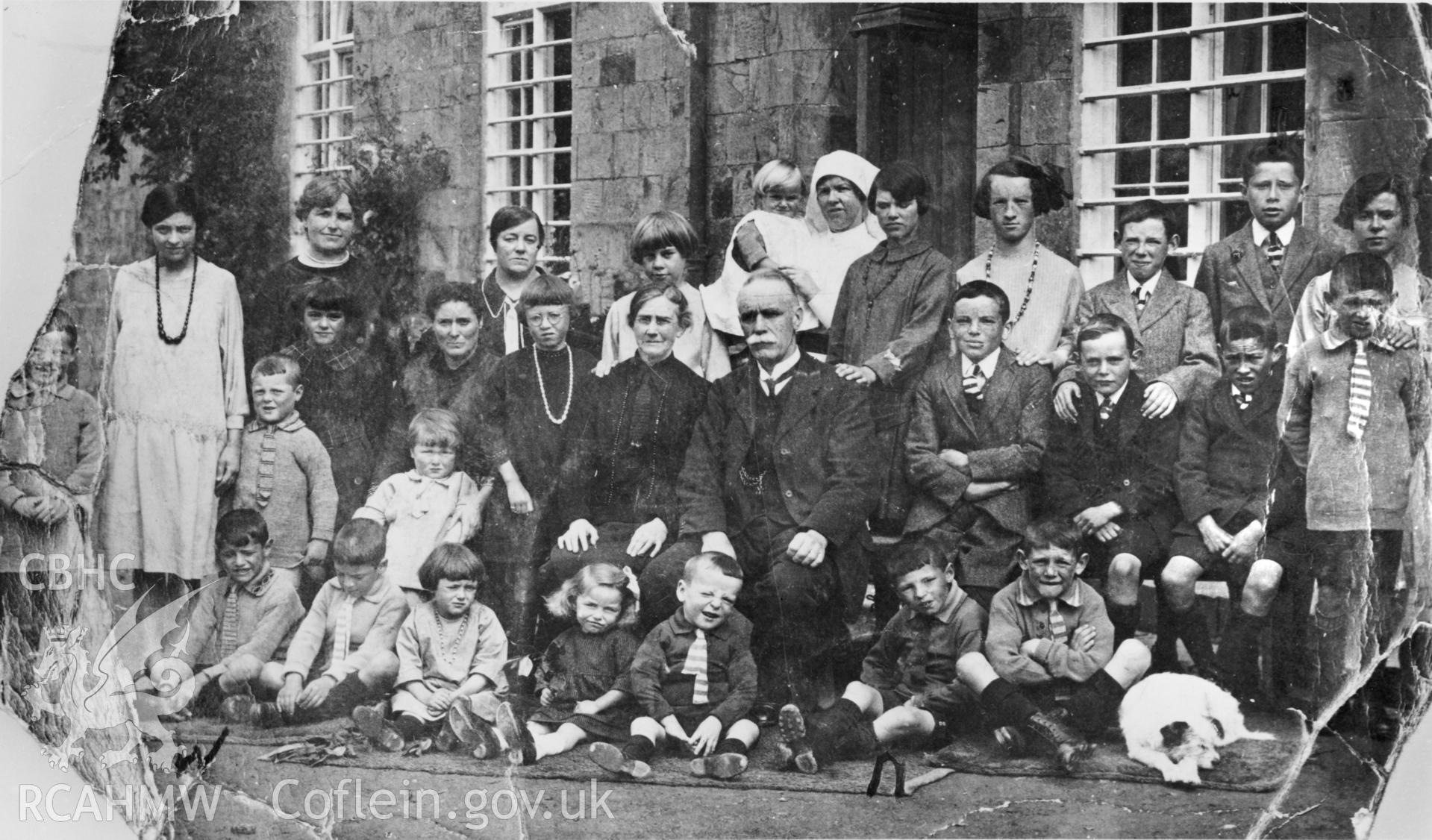 Digitized copy of a copy negative copied from a photograph showing a group portrait of the staff and orphans at Albro in 1927.