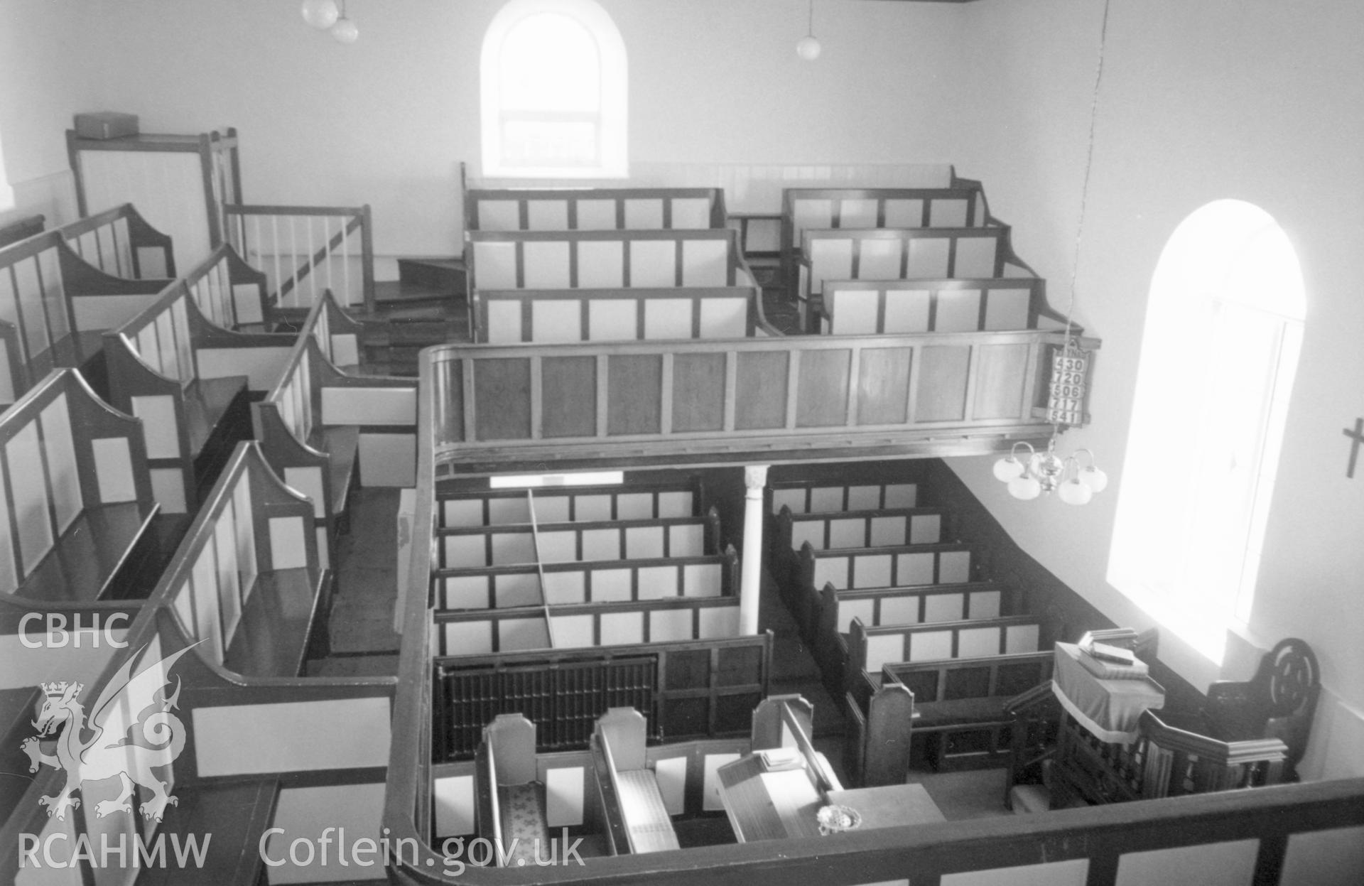 Digital copy of a black and white photograph showing an interior view of Pen-y-graig Independent Chapel, Llandyfaelog, taken by Robert Scourfield, c.1996.