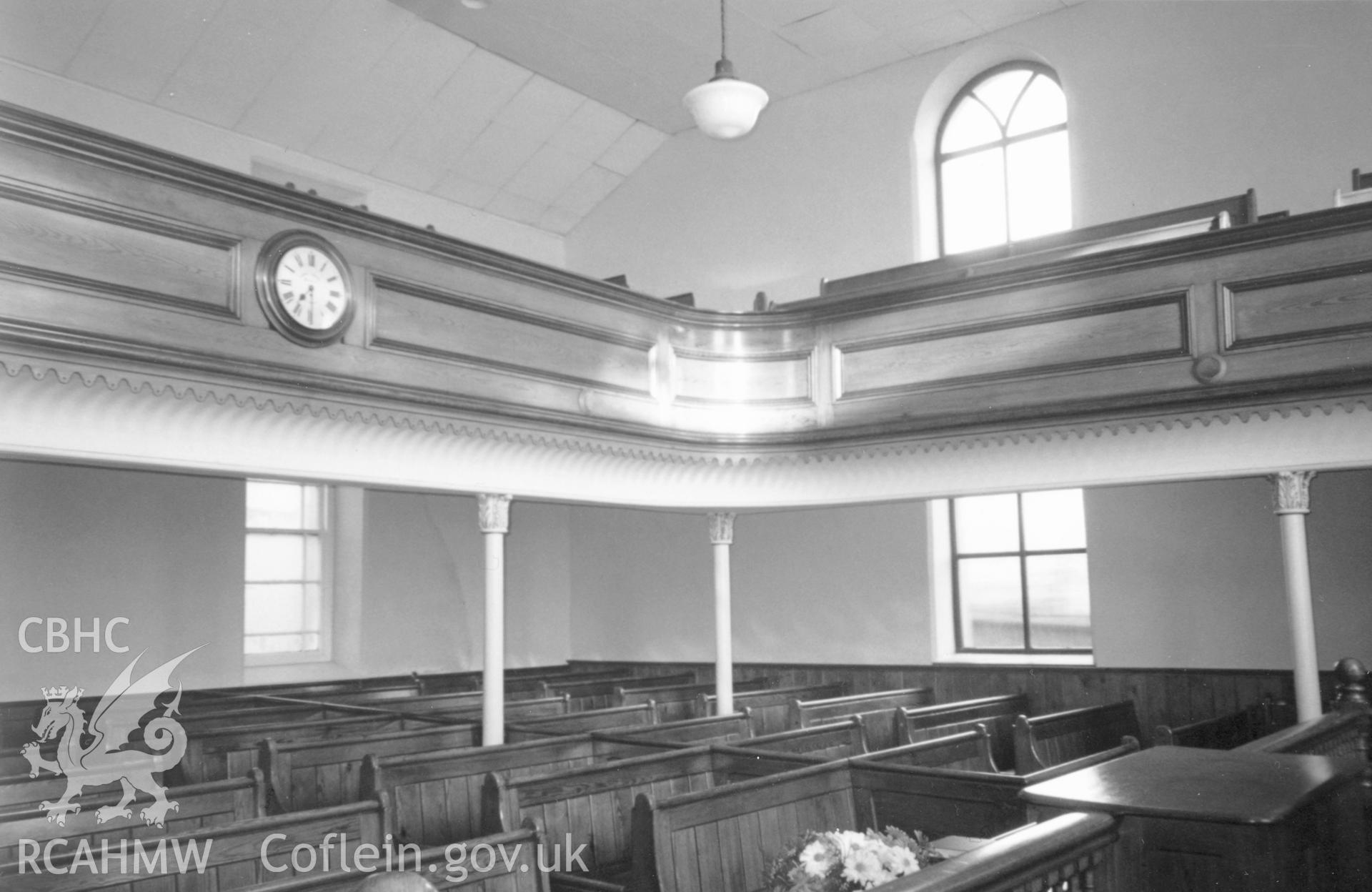 Digital copy of a black and white photograph showing an interior view of Cross Inn Welsh Calvinistic Methodist Chapel,  Court Henry, taken by Robert Scourfield, c.1996.
