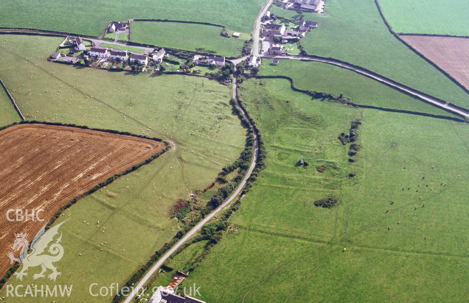 RCAHMW colour slide oblique aerial photograph of Marcross Grange Earthworks, St Donats, taken on 30/07/1992 by CR Musson