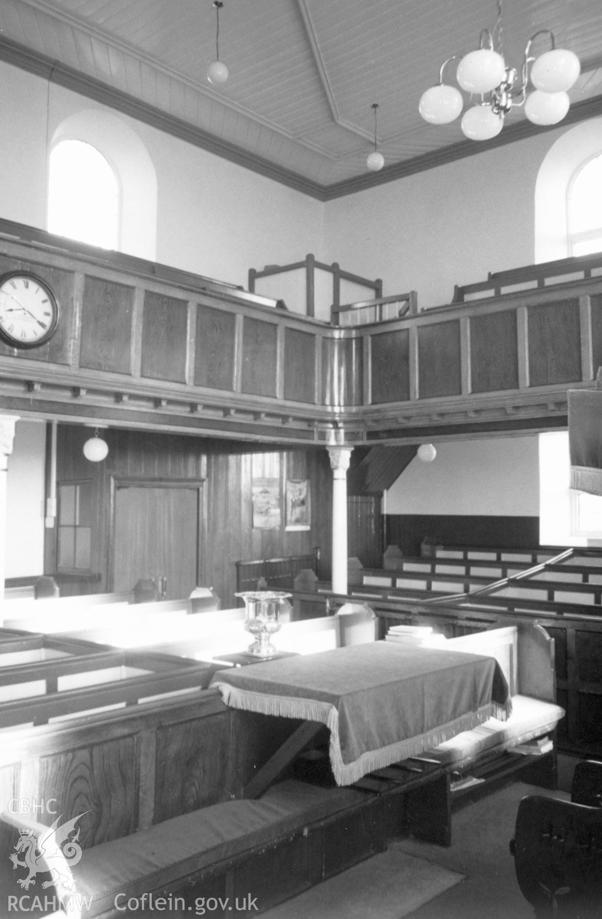 Digital copy of a black and white photograph showing an interior view of Pen-y-graig Independent Chapel, Llandyfaelog, taken by Robert Scourfield, c.1996.
