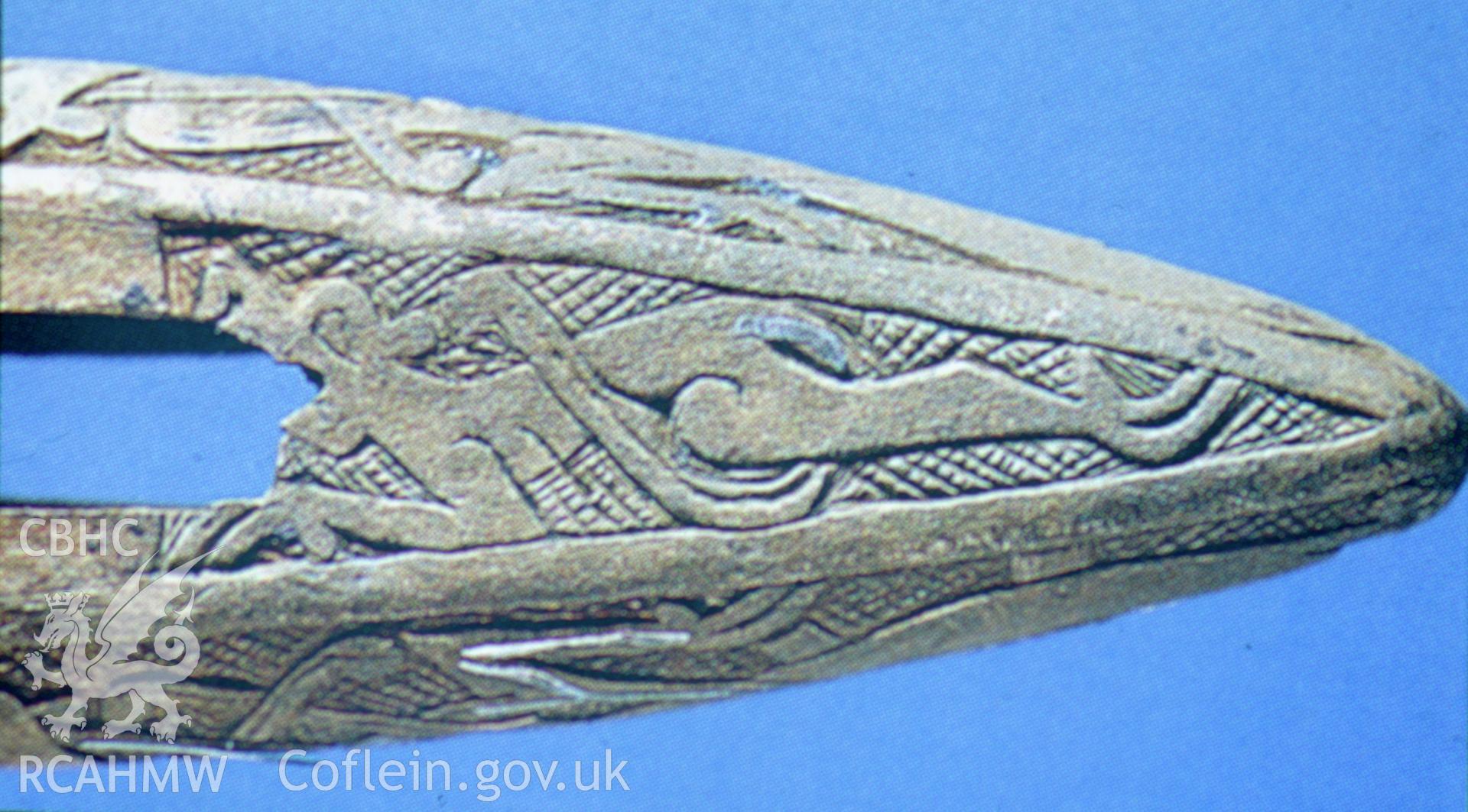 View of the Smalls Sword Hilt, revealing detail from the top face of the sword hilt showing one of the animals with open jaws in profile,  one of a set of 22 colour slides from a survey of the Smalls designated shipwreck area, carried out by the Archaeological Diving Unit. Courtesy National Museum of Wales