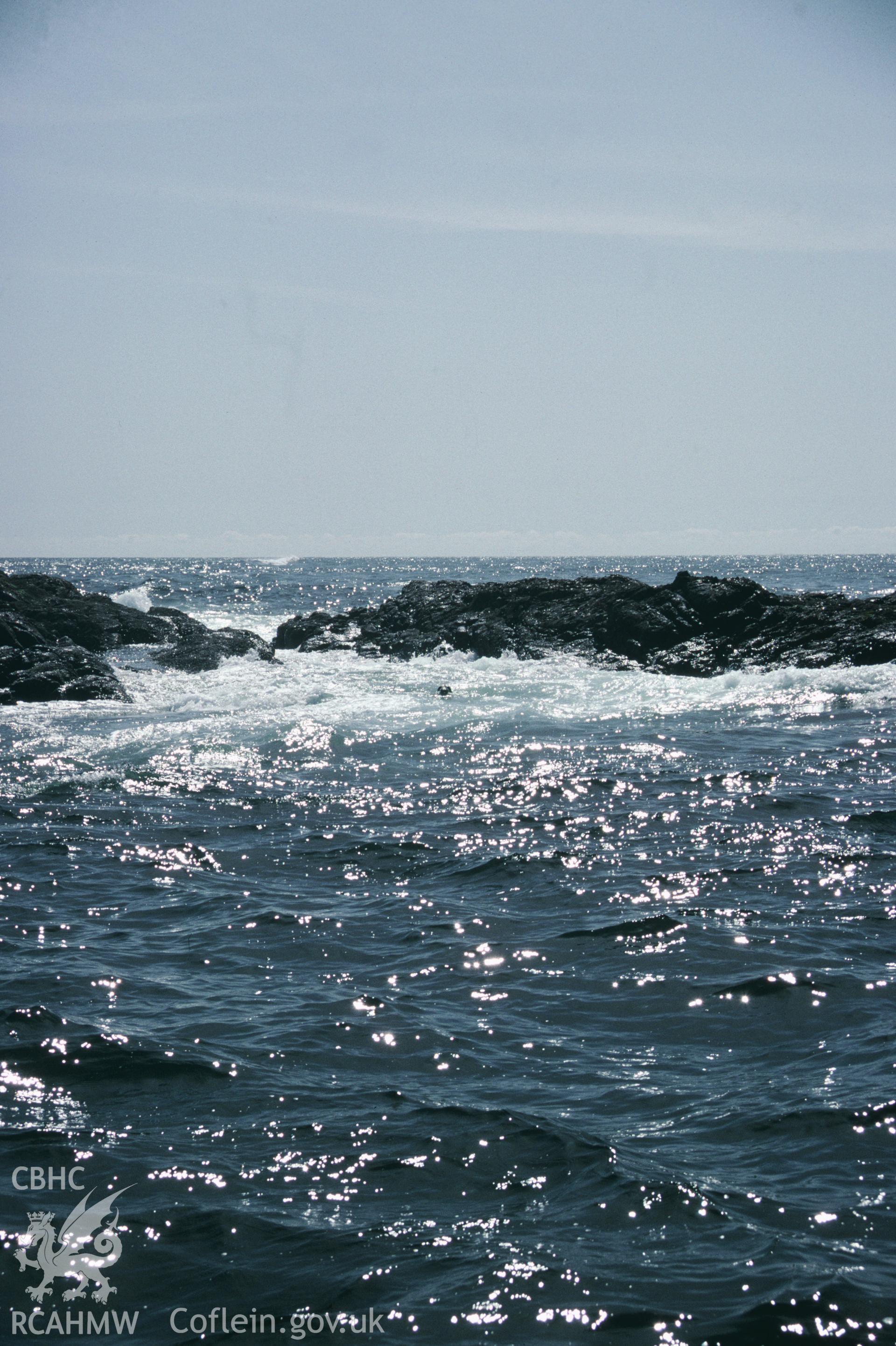 View of seawater surging through a gully between the rocky outcrops of the Smalls reef,  one of a set of 22 colour slides from a survey of the Smalls designated shipwreck area, carried out by the Archaeological Diving Unit.