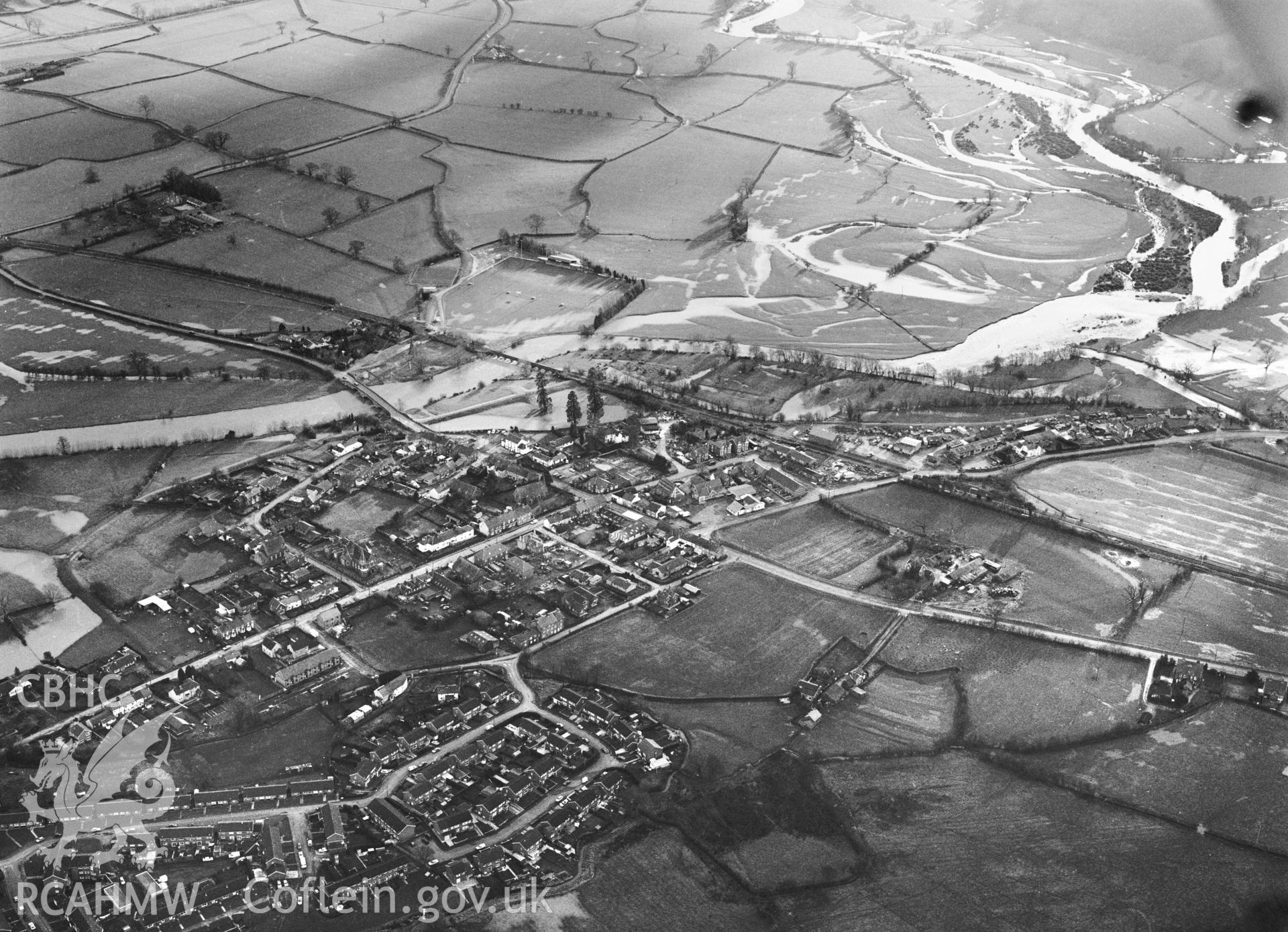 RCAHMW Black and white oblique aerial photograph of Caersws, Caersws, taken by C.R. Musson, 23/01/94