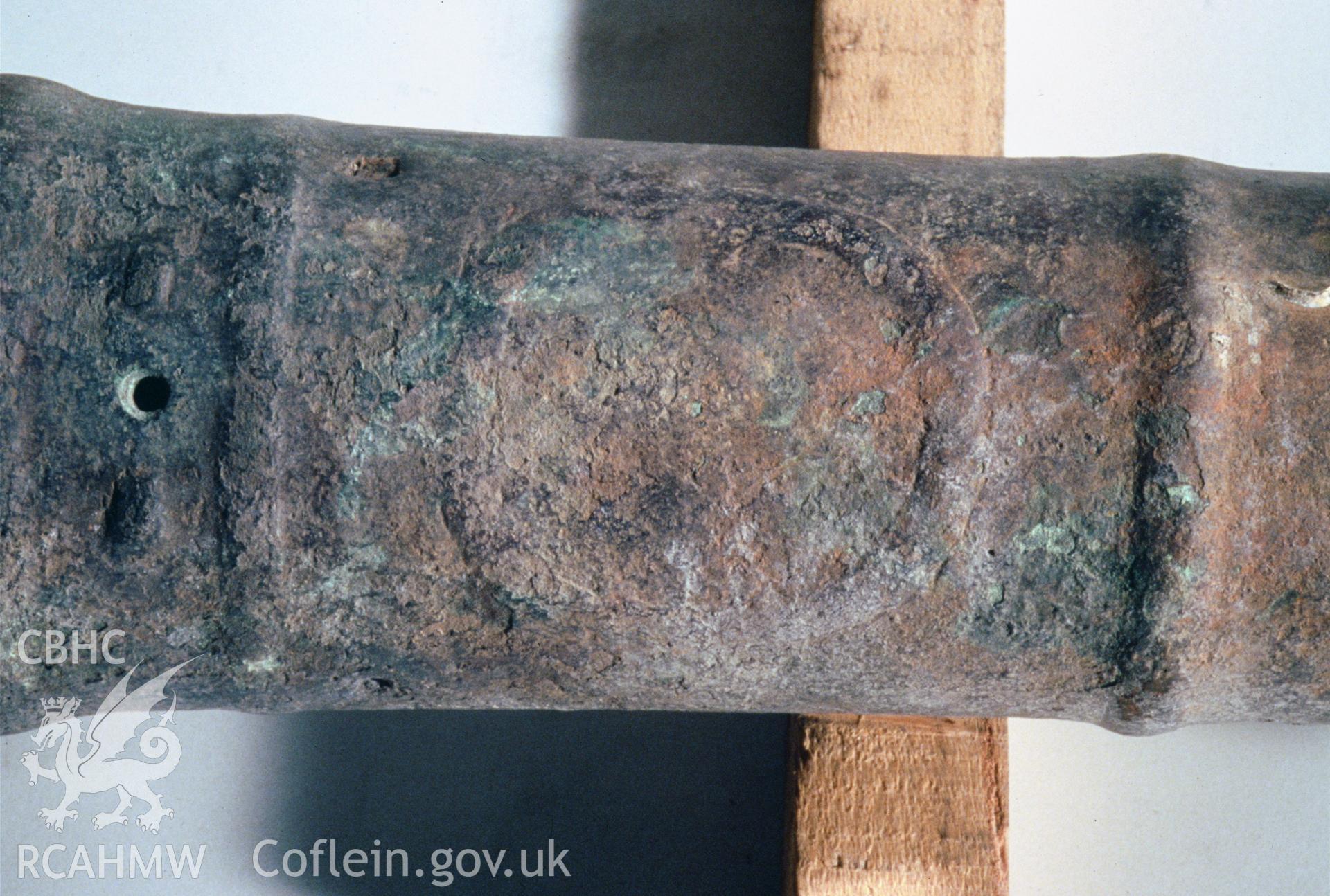 Colour slide showing gun find, first reinforce, badly corroded cartouche, from a survey of the Mary designated shipwreck, courtesy of National Museums, Liverpool (Merseyside Maritime Museum)