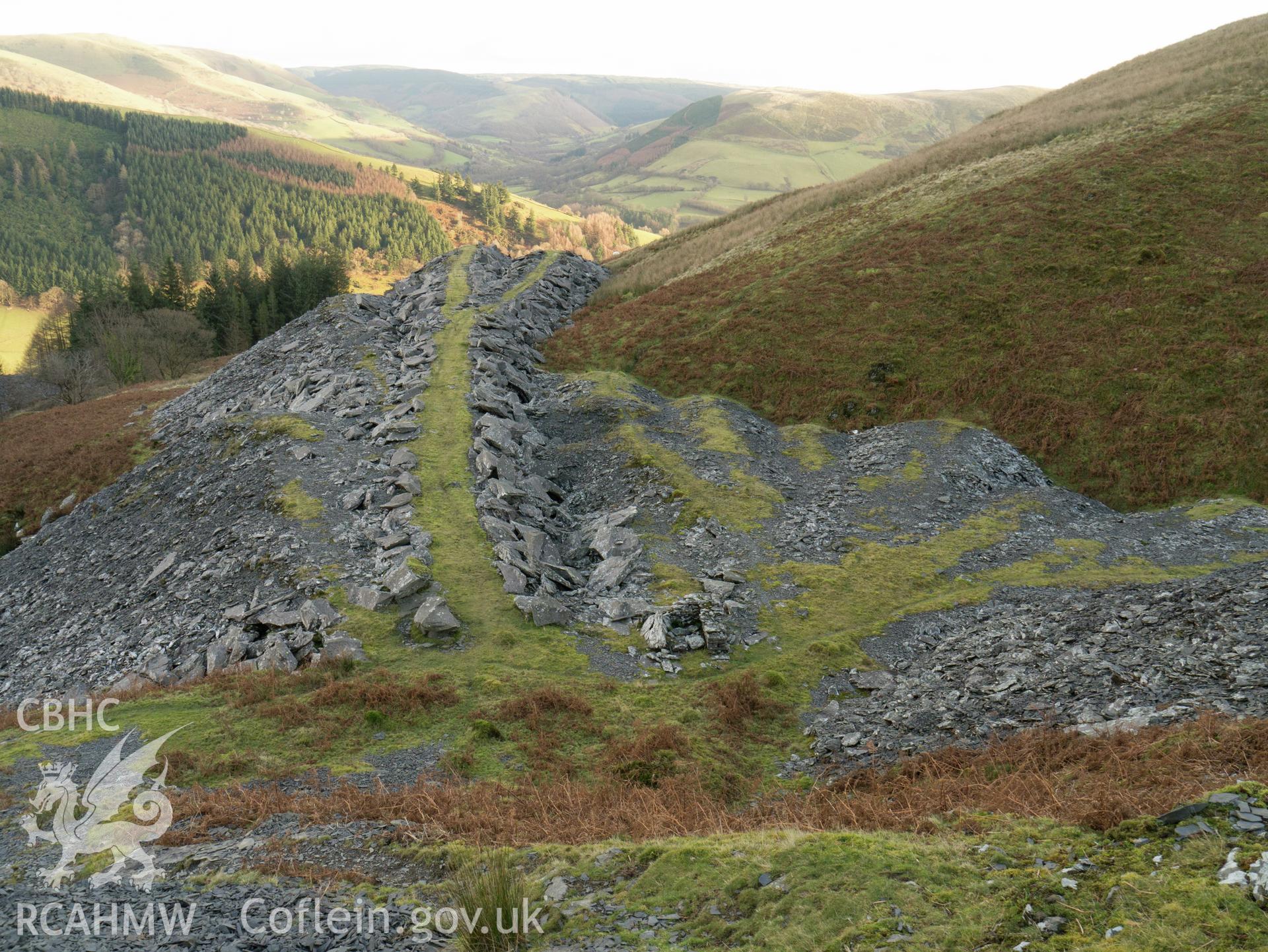view looking E from mine entrance, showing the fanning of individual phases of tipping.