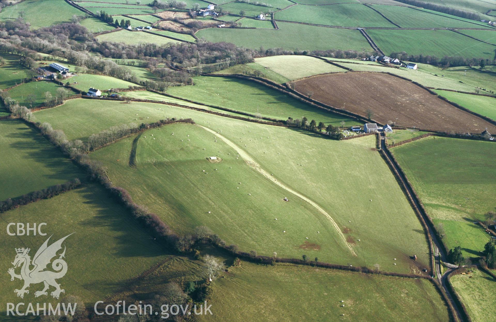 RCAHMW colour slide oblique aerial photograph of Pen-y-Gaer, Meidrim, taken by C.R.Musson on the 07/02/1997