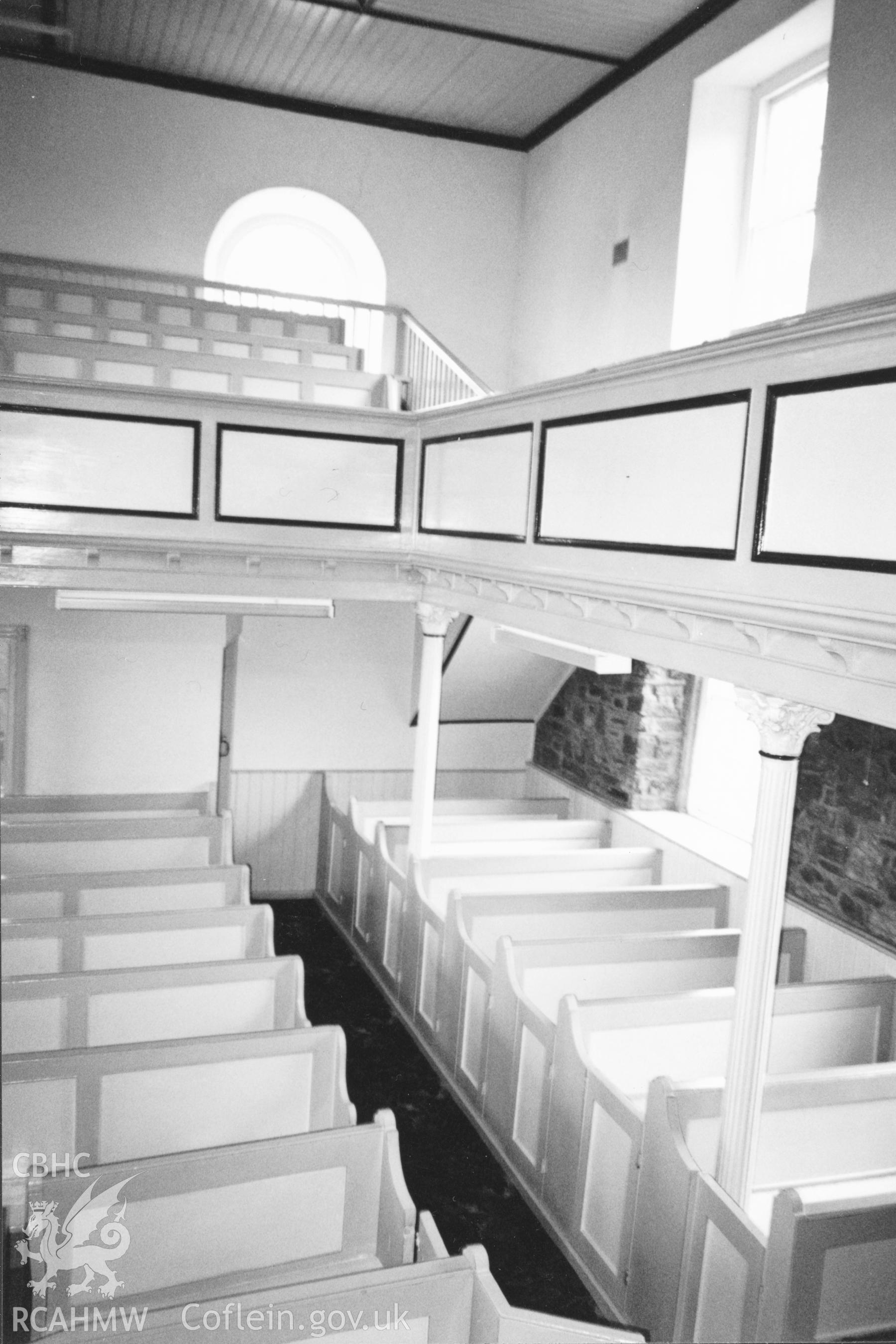 Digital copy of a black and white photograph showing an interior view of Rhydyceisiad Welsh Independent Chapel,  taken by Robert Scourfield, 1996.