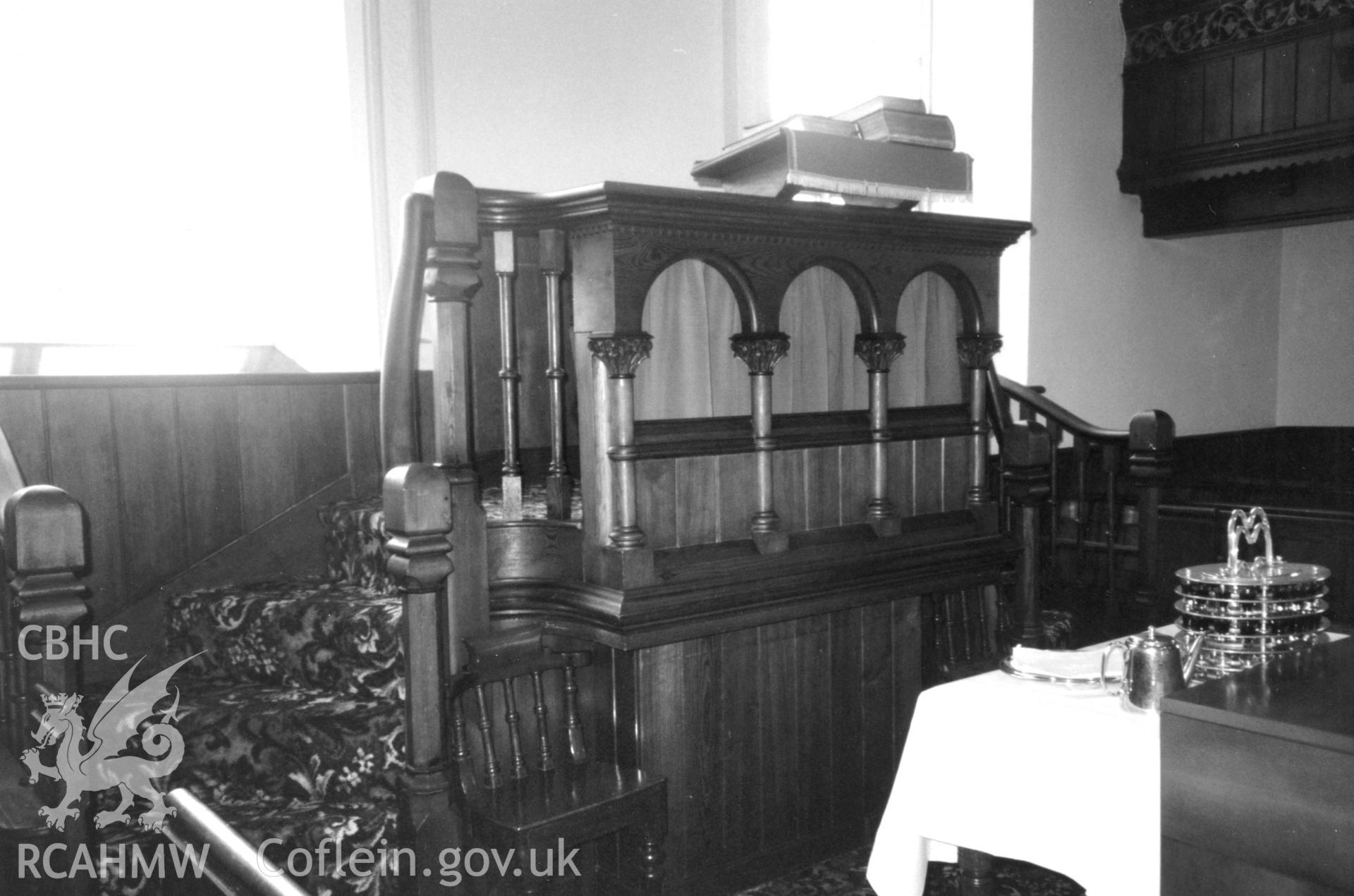 Digital copy of a black and white photograph showing an interior view of Tabor Welsh Independent Chapel, Llwyncelyn, Llanwrda, taken by Robert Scourfield, 1996.