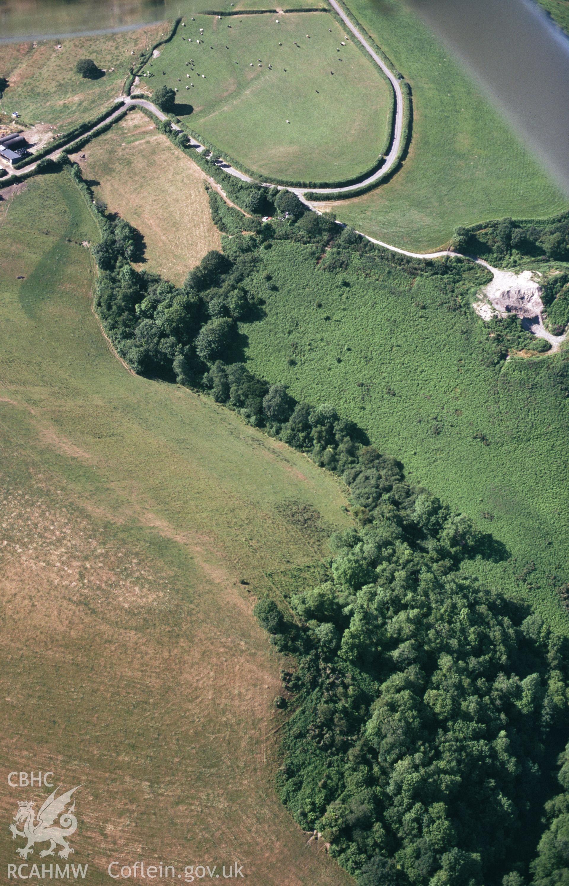 RCAHMW colour slide oblique aerial photograph of cropmark enclosure SE of Blaenwauneirch, Llanboidy, taken by C.R.Musson on the 25/07/1996