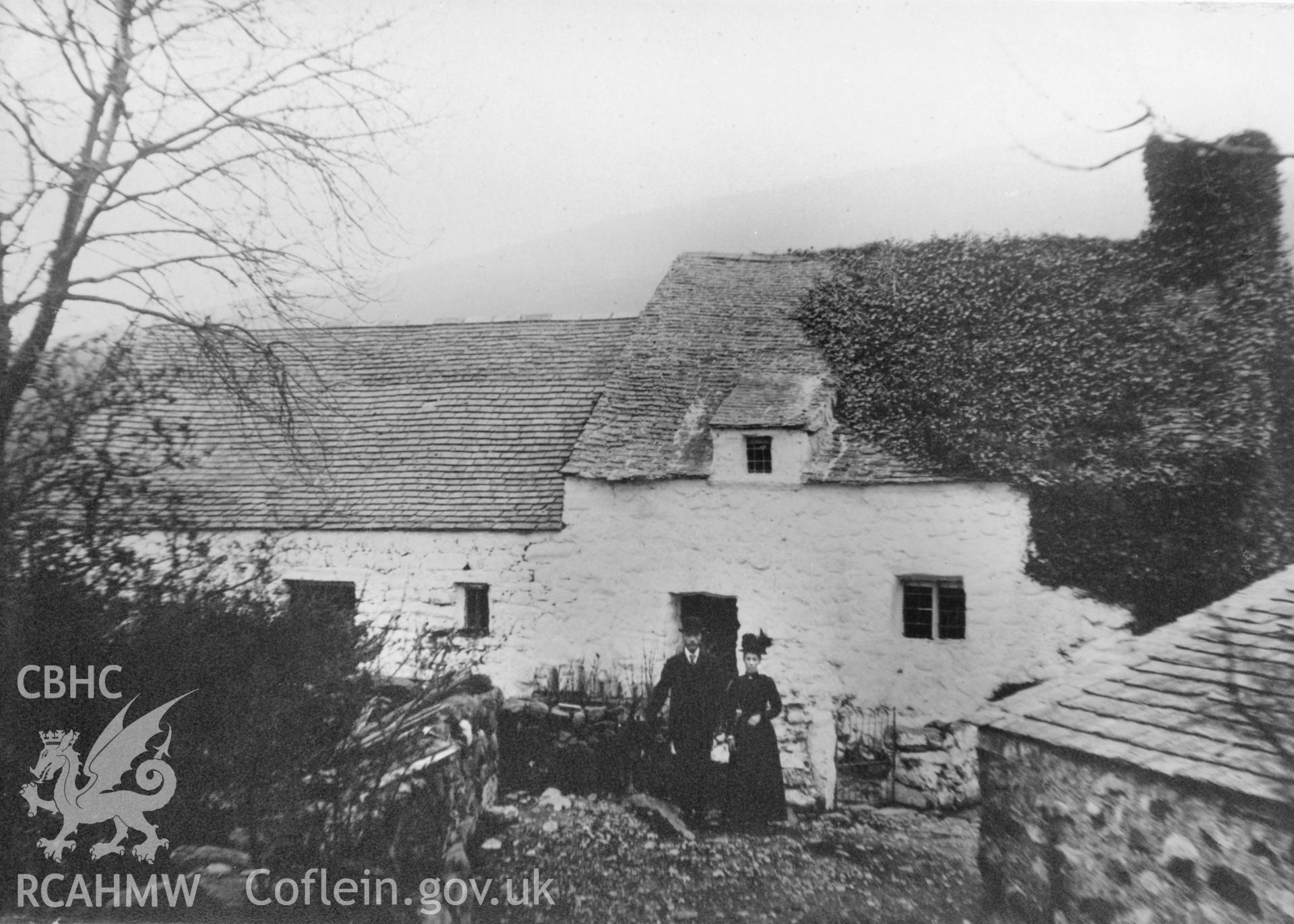 Pant Glas Uchaf, Clynnog;  one black and white photograph showing the main elevation of the cottage with two figures in the foreground, donated by G.Bernard Mason..