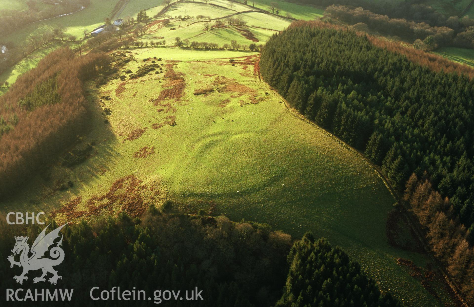 RCAHMW colour slide aerial photograph of Allt Aber-Mangoed, defended enclosure, stereo colour (left eye). Taken by Toby Driver on 05/12/2002