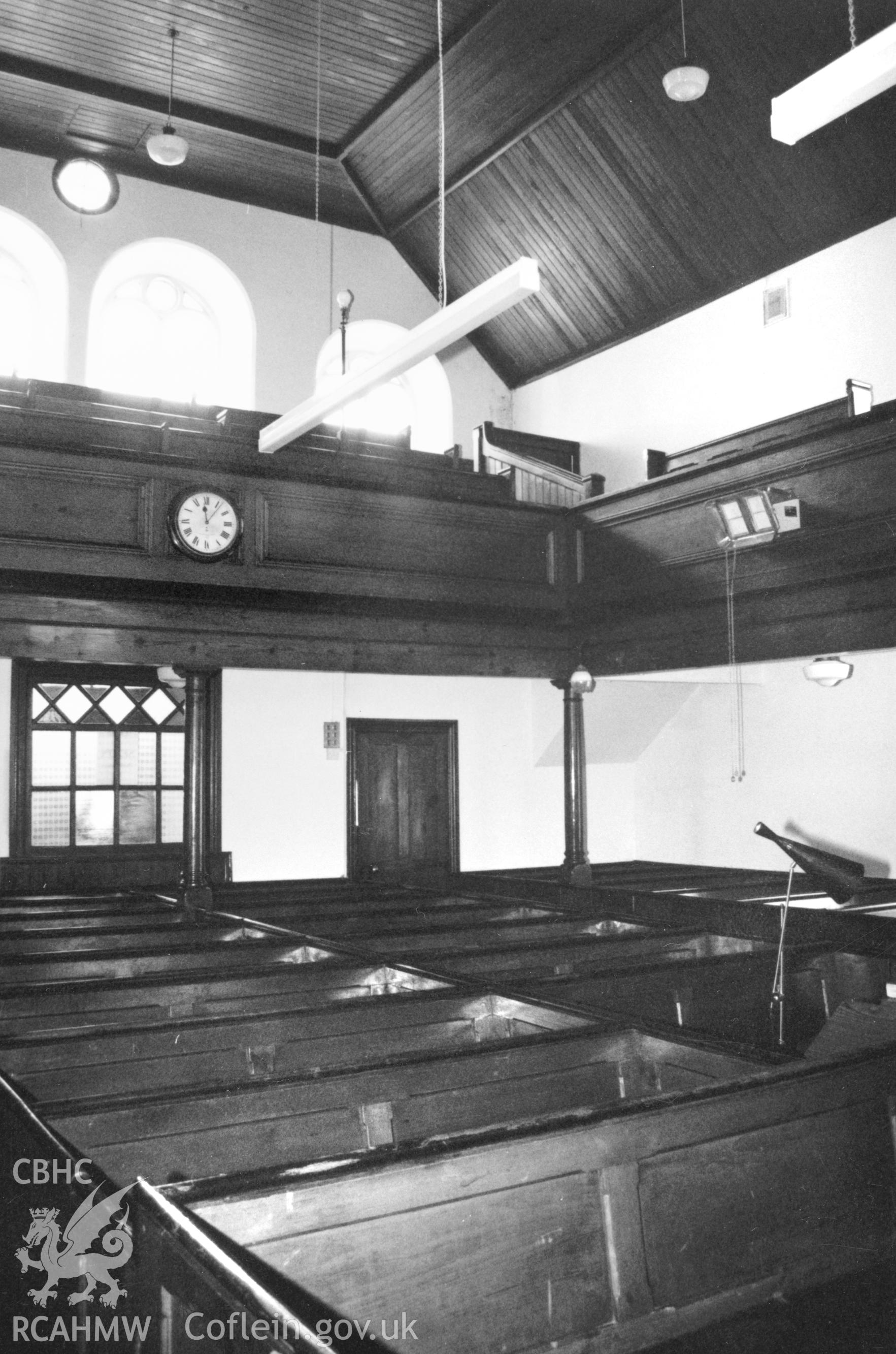 Digital copy of a black and white photograph showing an interior view of Seion Welsh Baptist Chapel, St David's,  taken by Robert Scourfield, 1995.