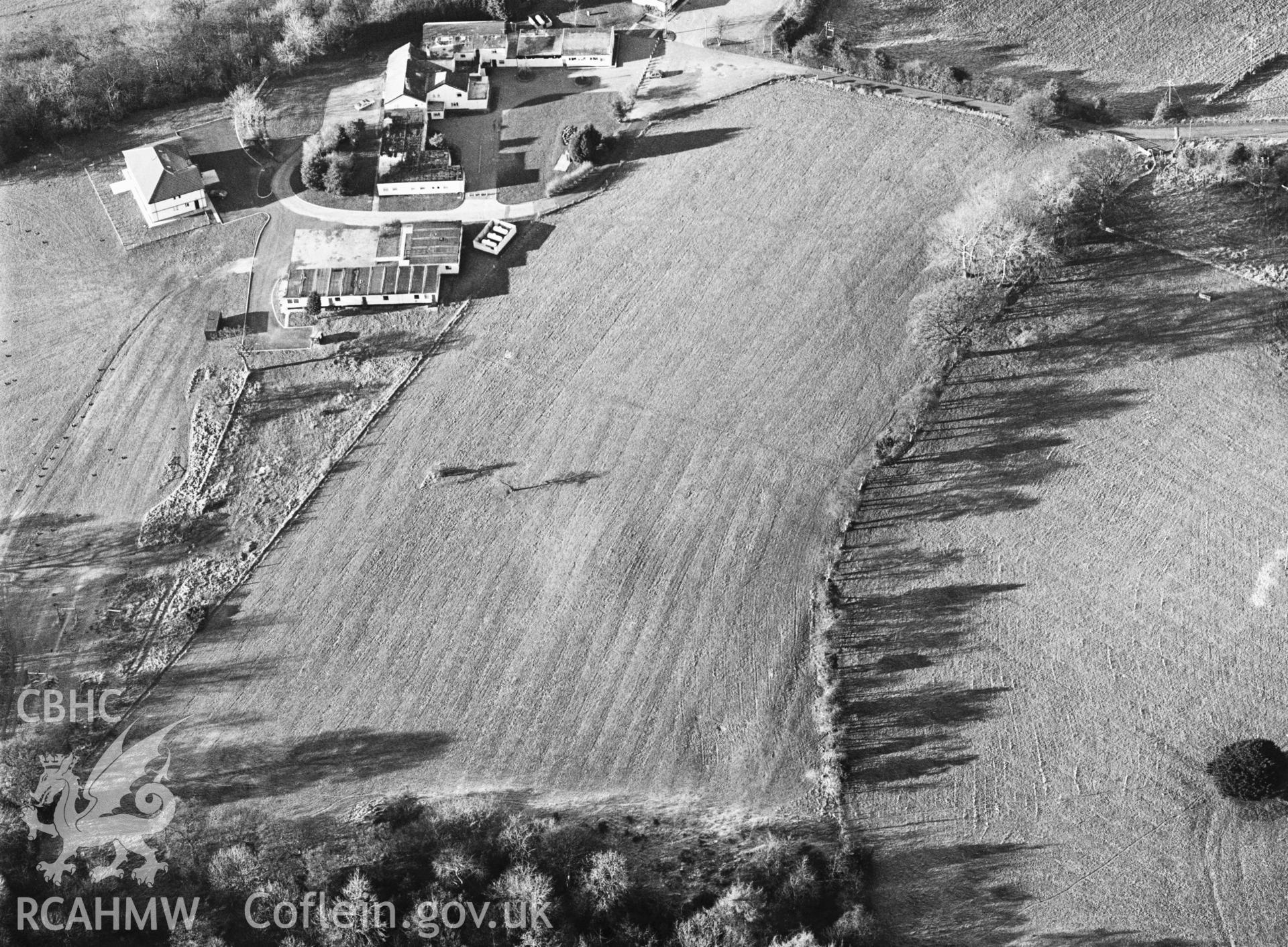 RCAHMW black and white oblique aerial photograph of Bryn Alyn Barrow, taken by C R Musson, 22/12/1996.