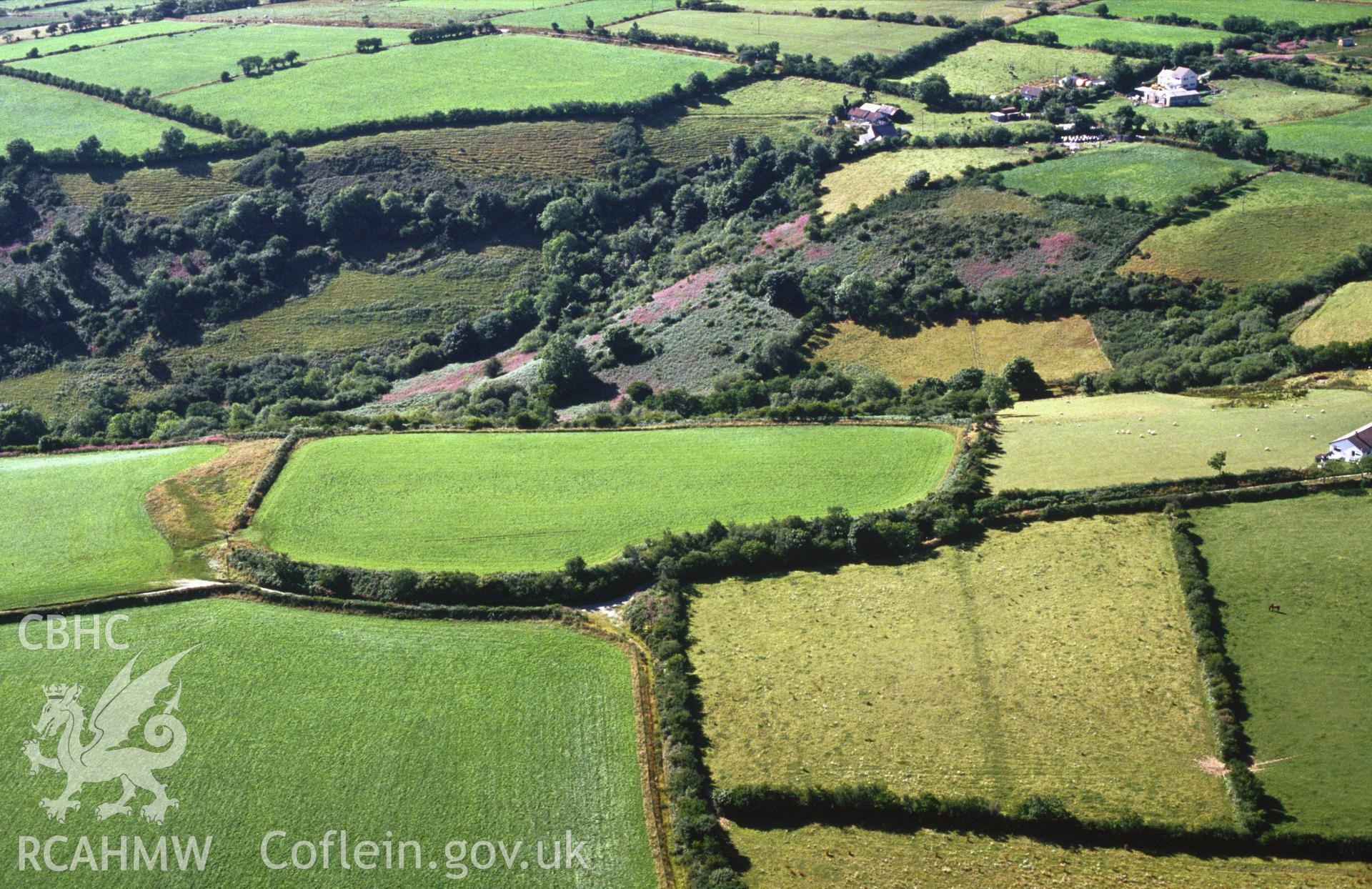 Slide of RCAHMW colour oblique aerial photograph of Croes Arthur hillfort, Abergwili, taken by C.R. Musson, 1989.