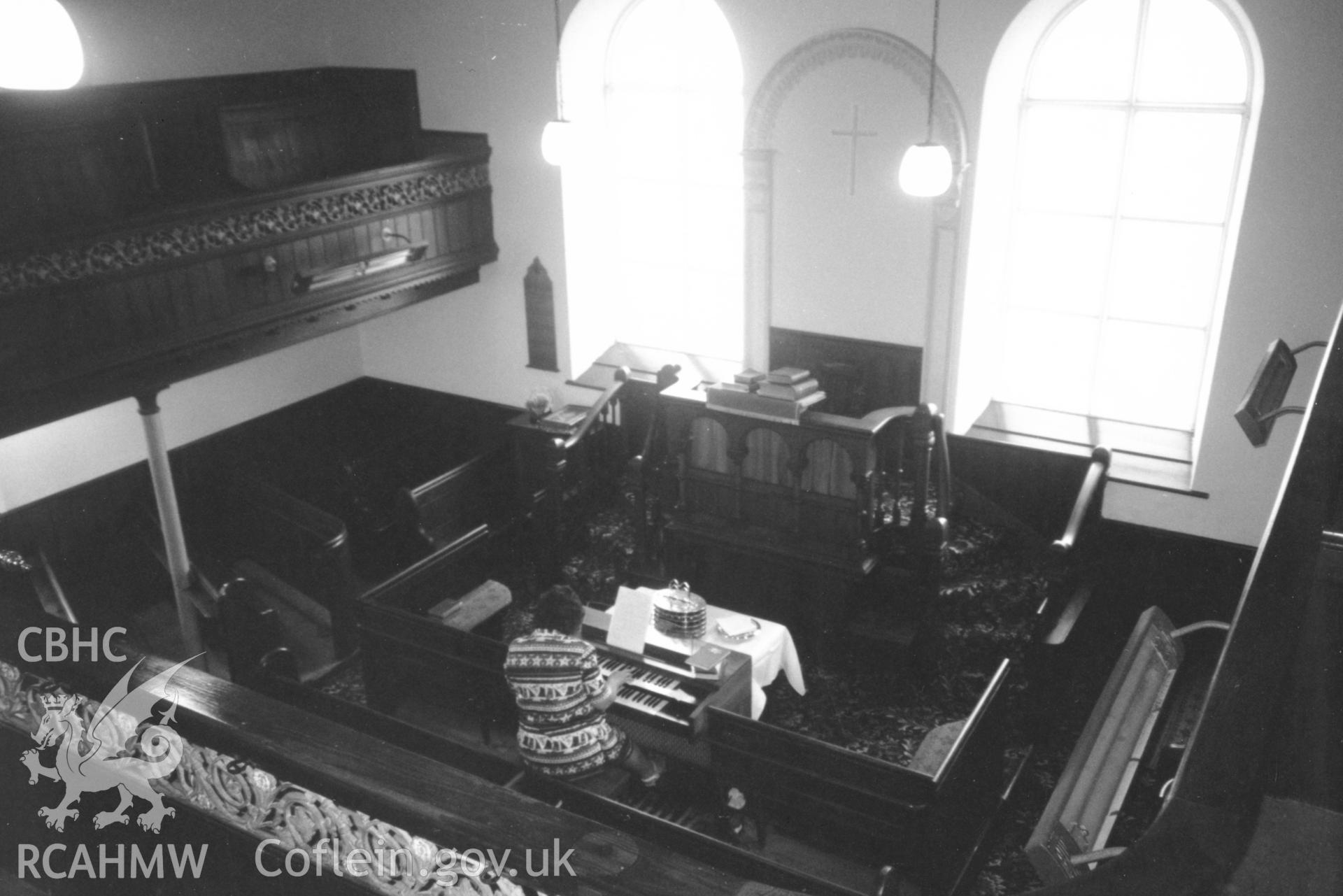Digital copy of a black and white photograph showing an interior view of Tabor Welsh Independent Chapel, Llwyncelyn, Llanwrda, taken by Robert Scourfield, 1996.