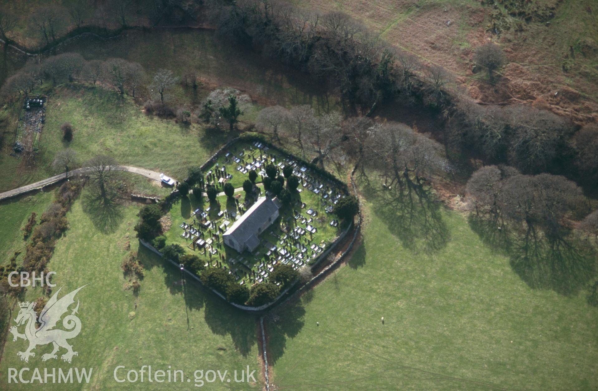 RCAHMW colour slide oblique aerial photograph of St Michael's Church, Talsarnau, taken by C.R.Musson on the 30/03/1996