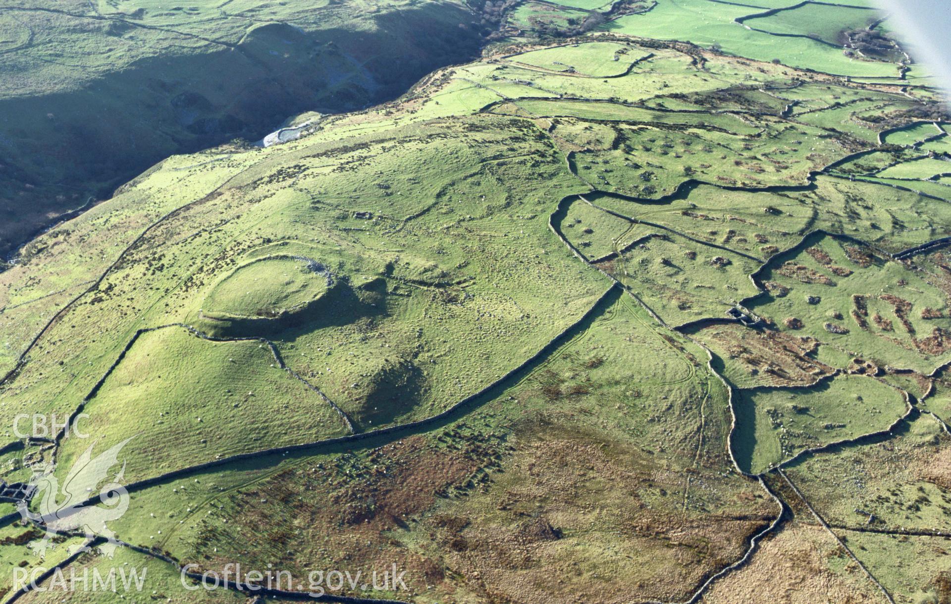 Slide of RCAHMW colour oblique aerial photograph of Pen Dinas Hillfort and field systems at Ardudwy, taken by T.G. Driver, 2005.