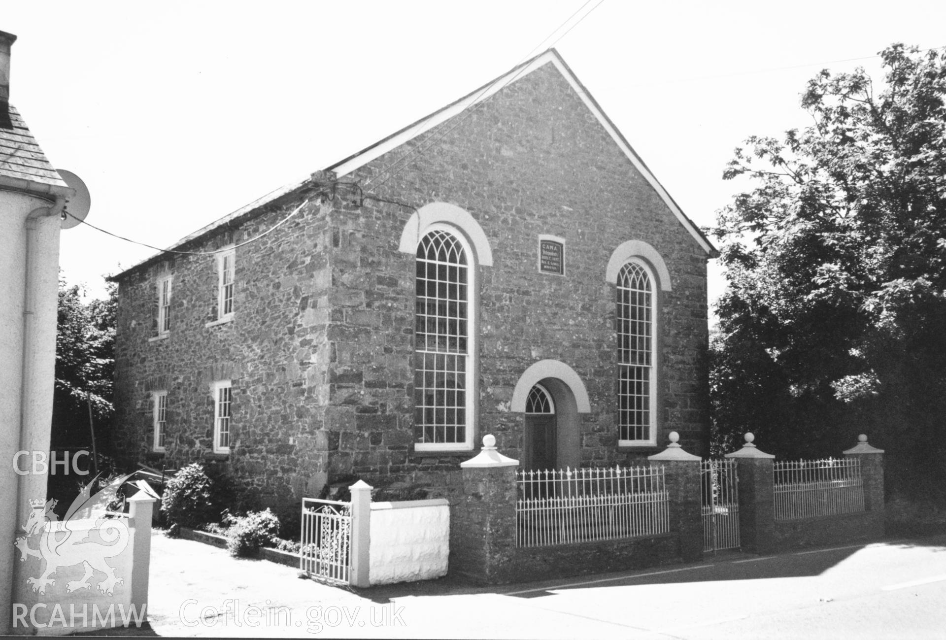 Digital copy of a black and white photograph showing an exterior view of Cana Welsh Independent Chapel, Bayvil, taken by Robert Scourfield, c.1996.