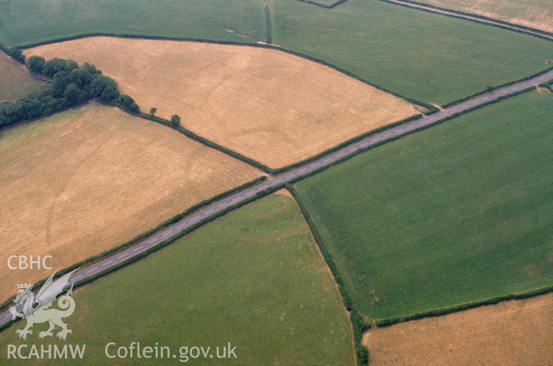 RCAHMW colour slide oblique aerial photograph of Blaenffynhonnau South Cropmark Enclosure, Llangynin, taken on 29/06/1992 by CR Musson