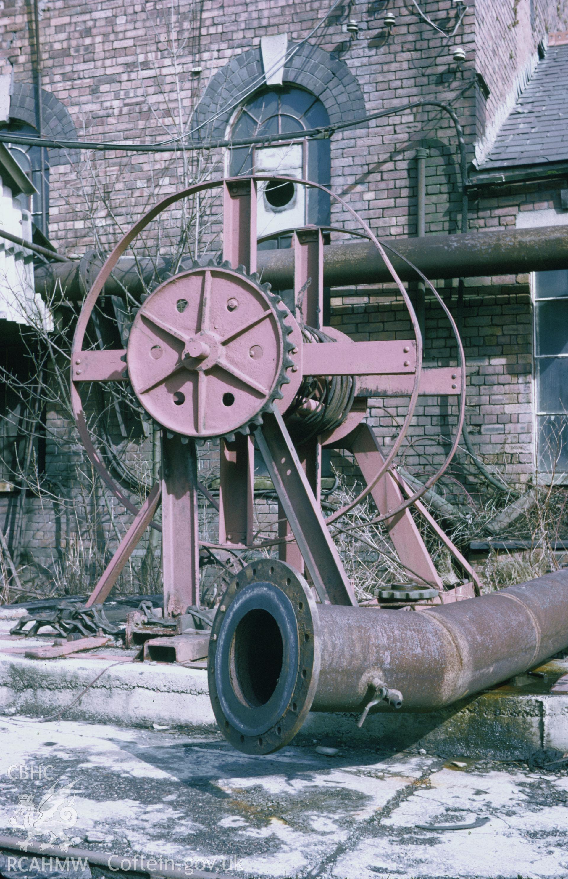 Colour 35mm slide of machinery at Blaina Mine, with the engine house in the background, Ammanford, Carmarthenshire, by Dylan Roberts.