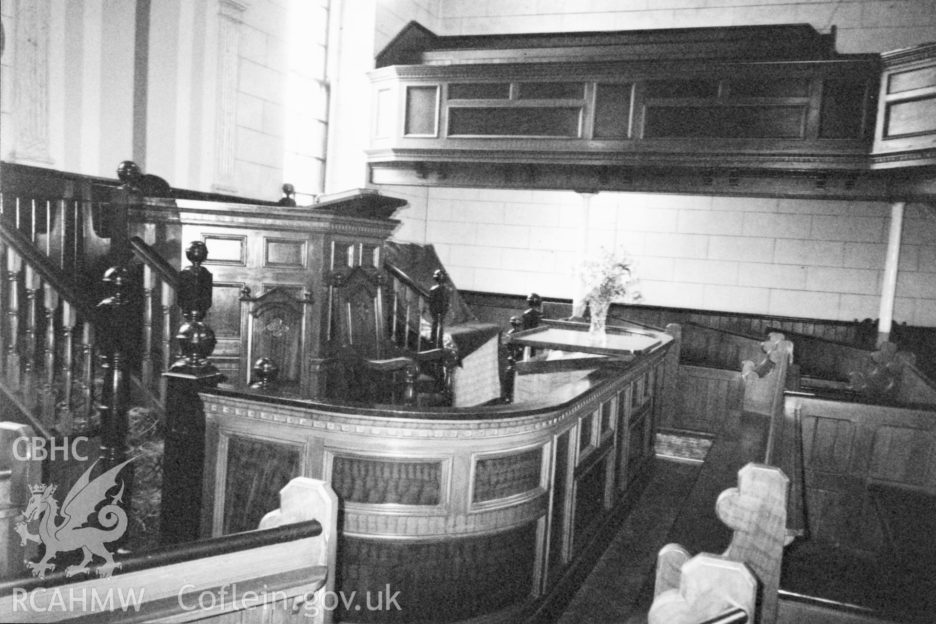 Digital copy of a black and white photograph showing an interior view of Tabernacl Calvinistic Methodist Chapel, Llanddowror, taken by Robert Scourfield, 1996.
