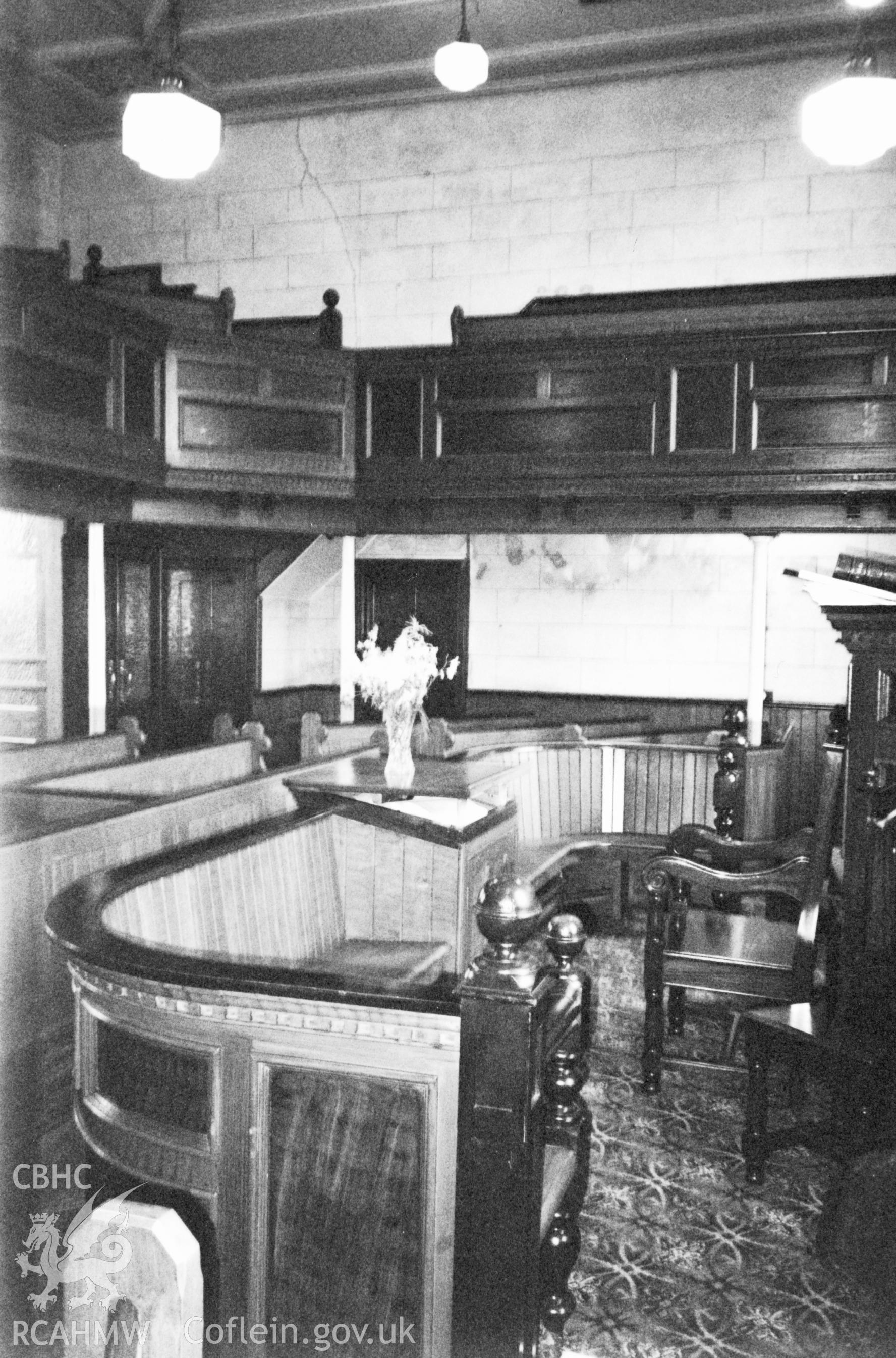 Digital copy of a black and white photograph showing an interior view of Tabernacl Welsh Calvinistic Methodist Chapel, Llanddowror, taken by Robert Scourfield, 1996.