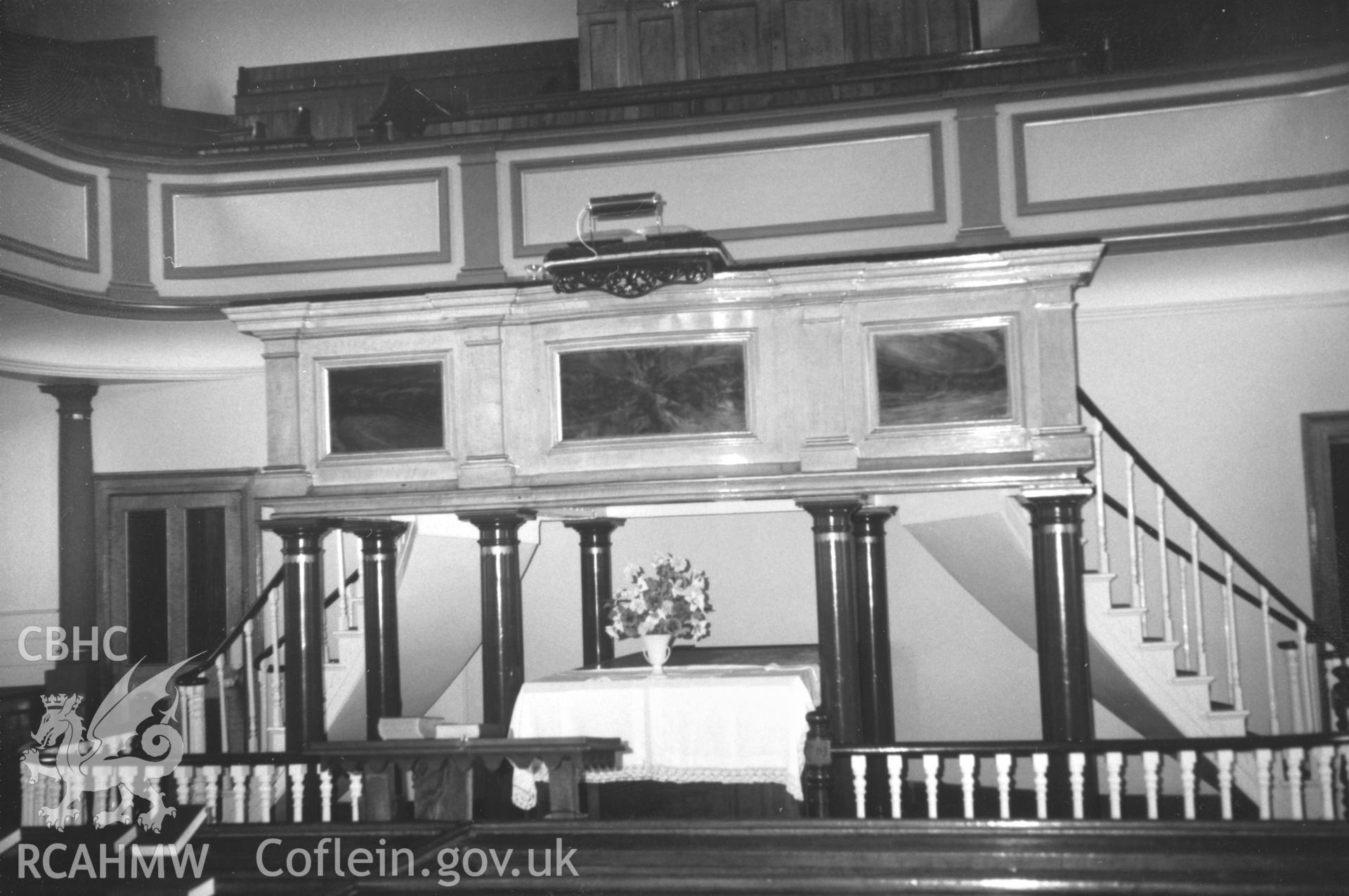 Digital copy of a black and white photograph showing an interior view of Zion Wesleyan Methodist Chapel, Pembroke Dock, taken by Robert Scourfield, c.1996.