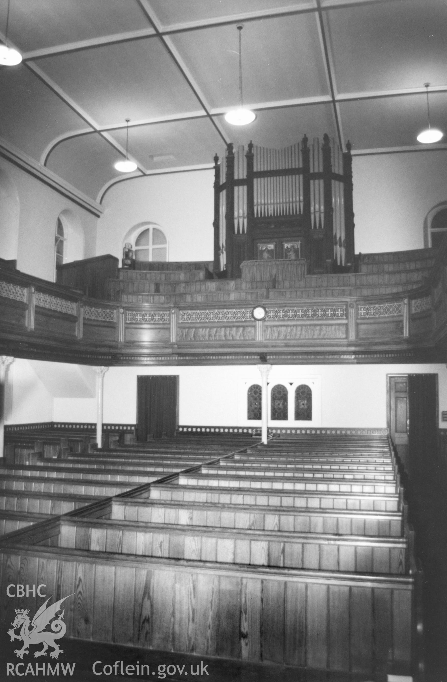 Digital copy of a black and white photograph showing an interior view of Hill Park Baptist Chapel, Haverfordwest, taken by Robert Scourfield, 1996.