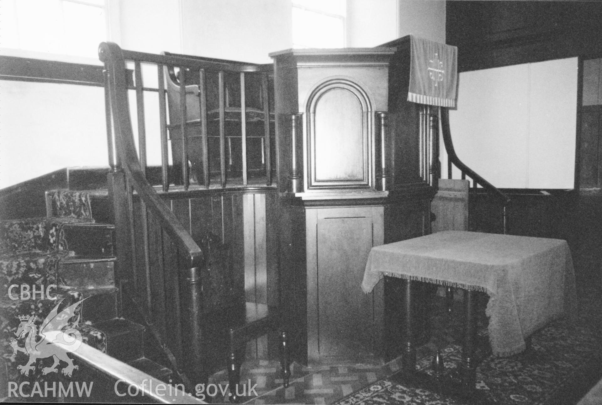 Digital copy of a black and white photograph showing an interior view of Caerfarchell Calvinistic Mehodist Chapel, St Davids, taken by Robert Scourfield, 1996.