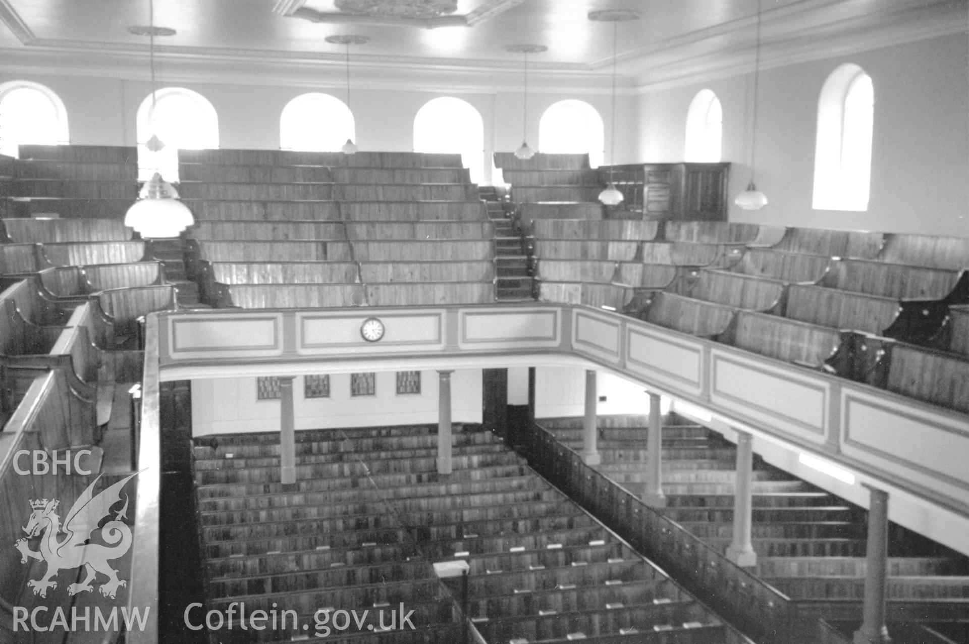 Digital copy of a black and white photograph showing an interior view of Zion Wesleyan Methodist Chapel, Pembroke Dock, taken by Robert Scourfield, c.1996.